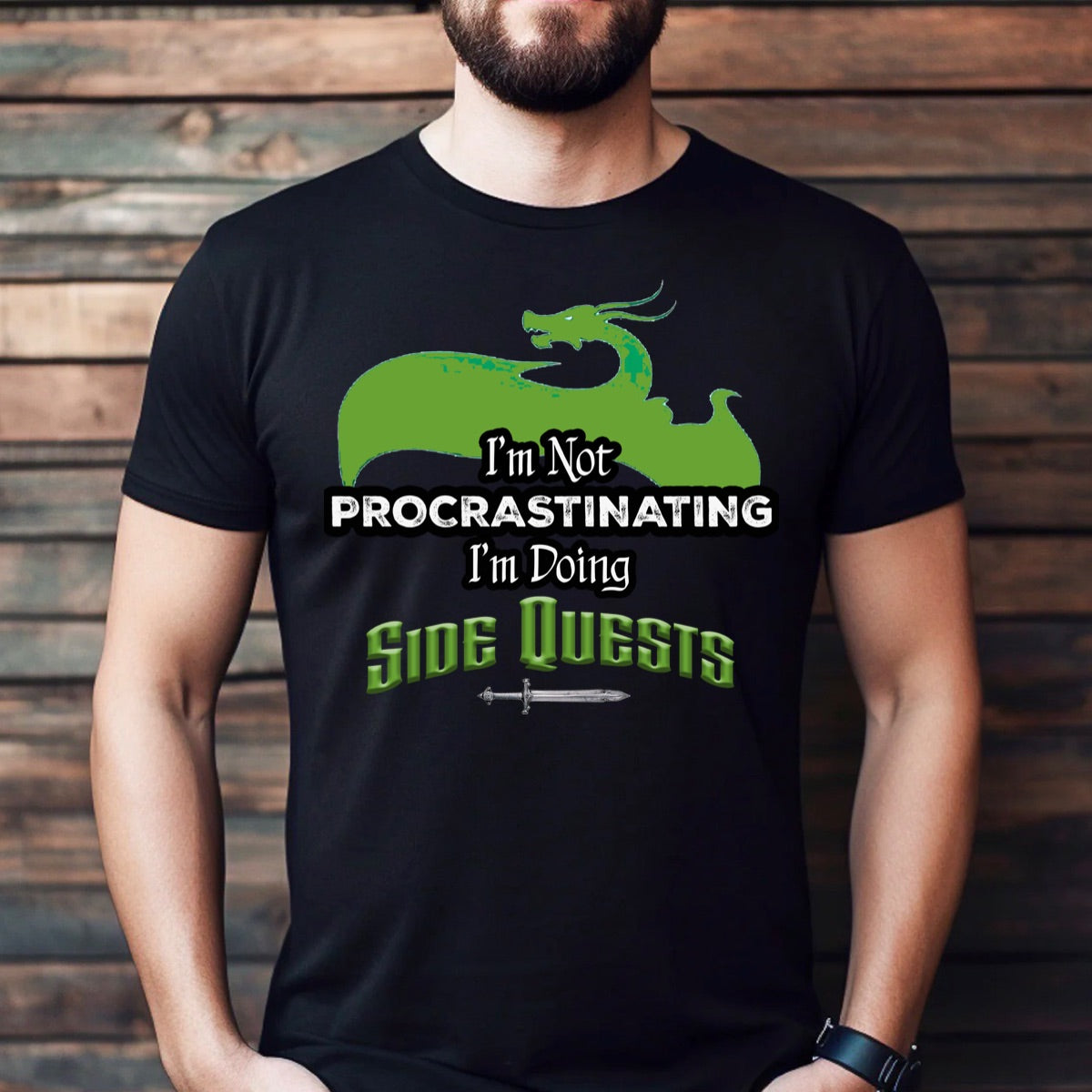 Man wearing black graphic tee with green dragon design and text I'm not procrastinating I'm doing side quests