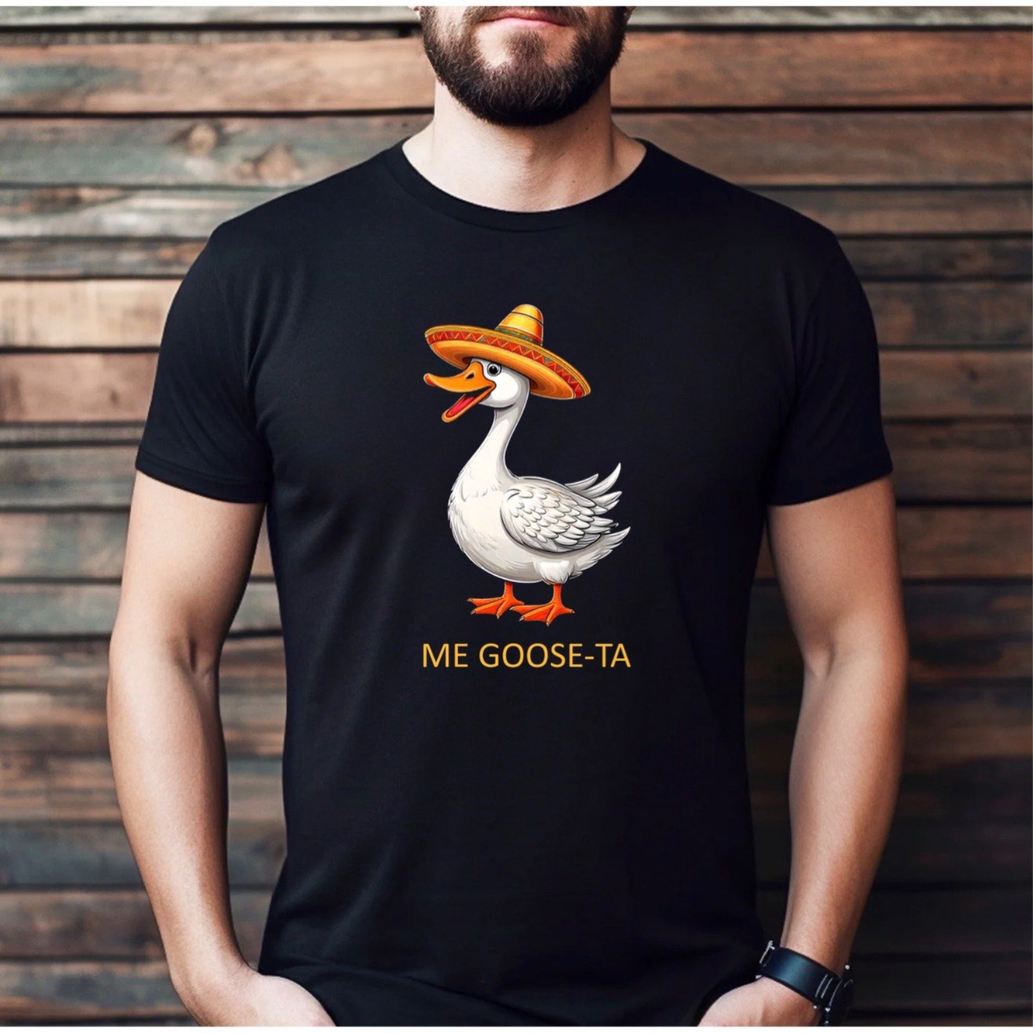 Man wearing black funny t-shirt with goose in sombrero and Me Goose-Ta text