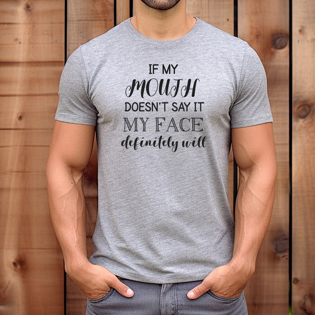 Man wearing funny quote grey t-shirt that says "If my mouth doesn’t say it my face definitely will."