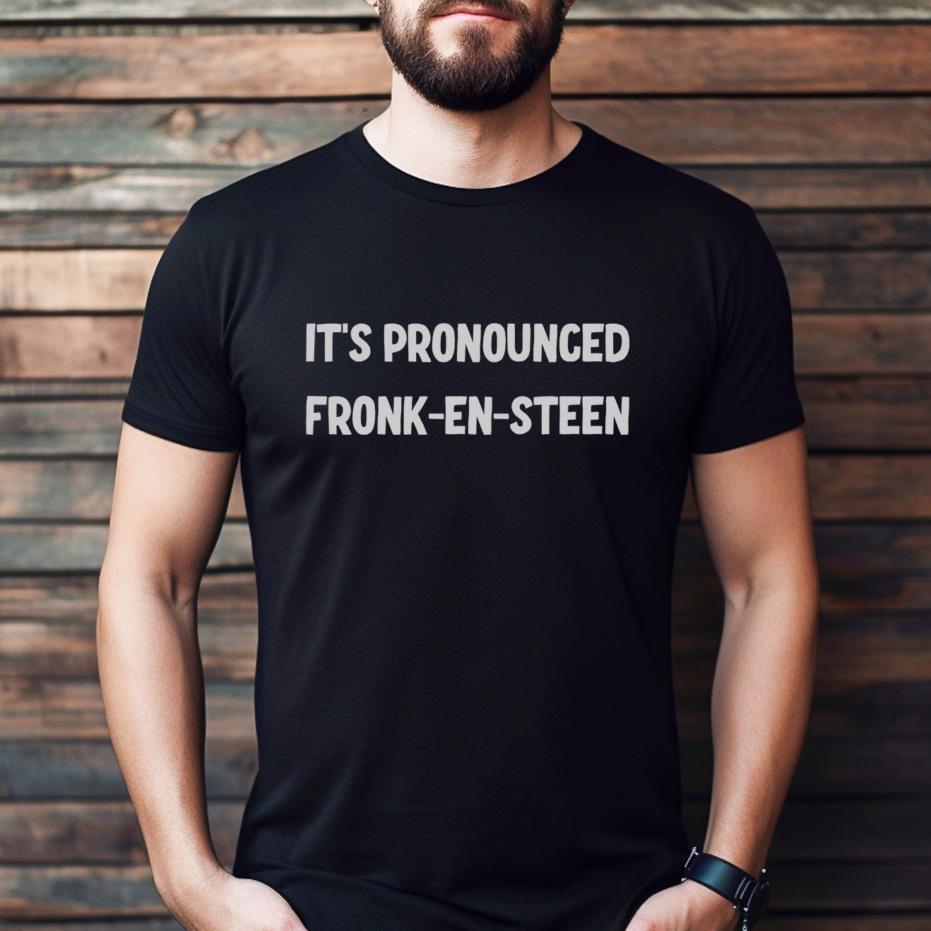 Man wearing a black t-shirt with the phrase “It’s Pronounced Fronk-en-Steen” in bold lettering.