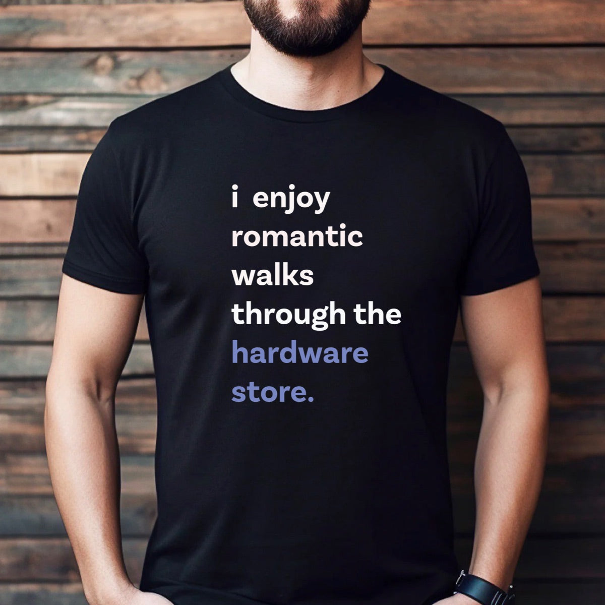 Man wearing black t-shirt with text i enjoy romantic walks through the hardware store in white and blue