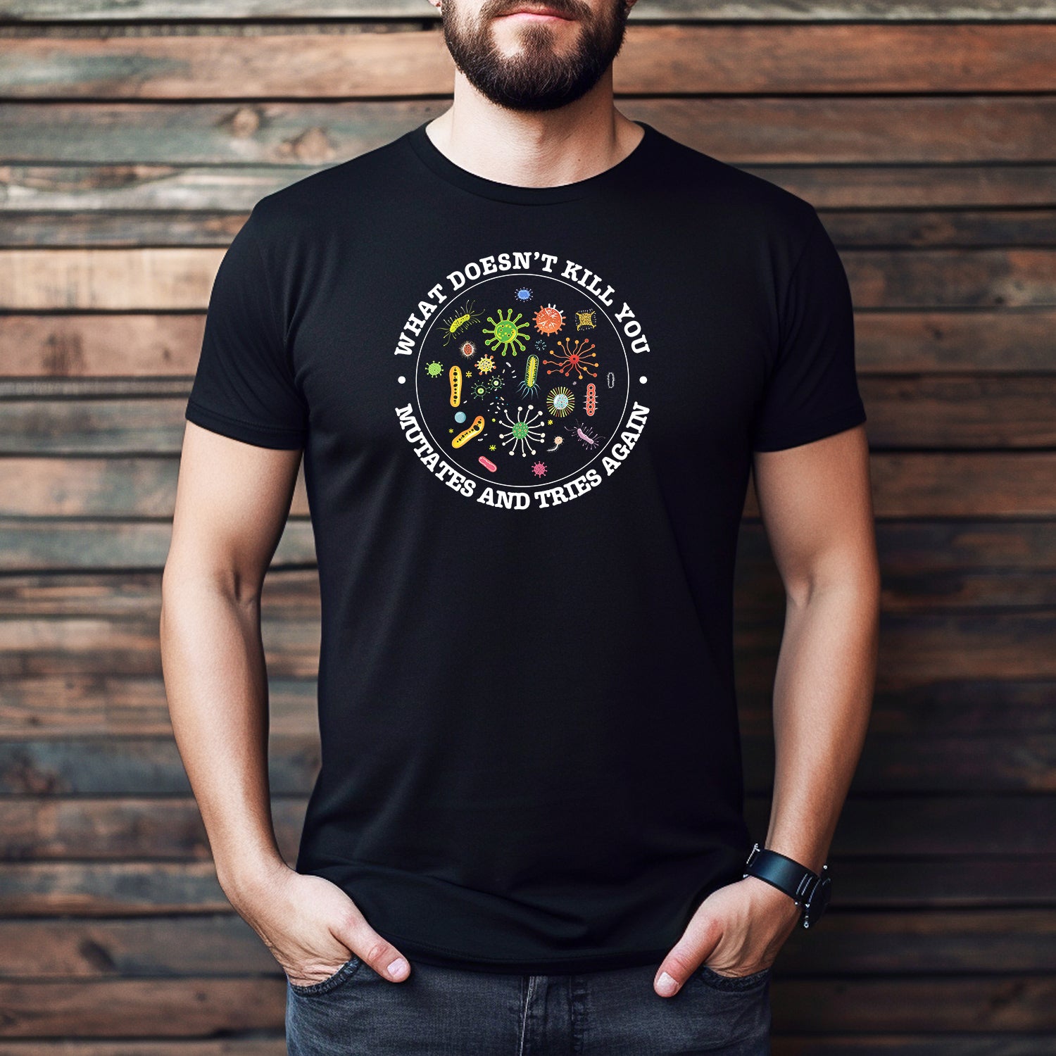 Men’s black crewneck t-shirt with colorful germ design and text What Doesn’t Kill You Mutates and Tries Again