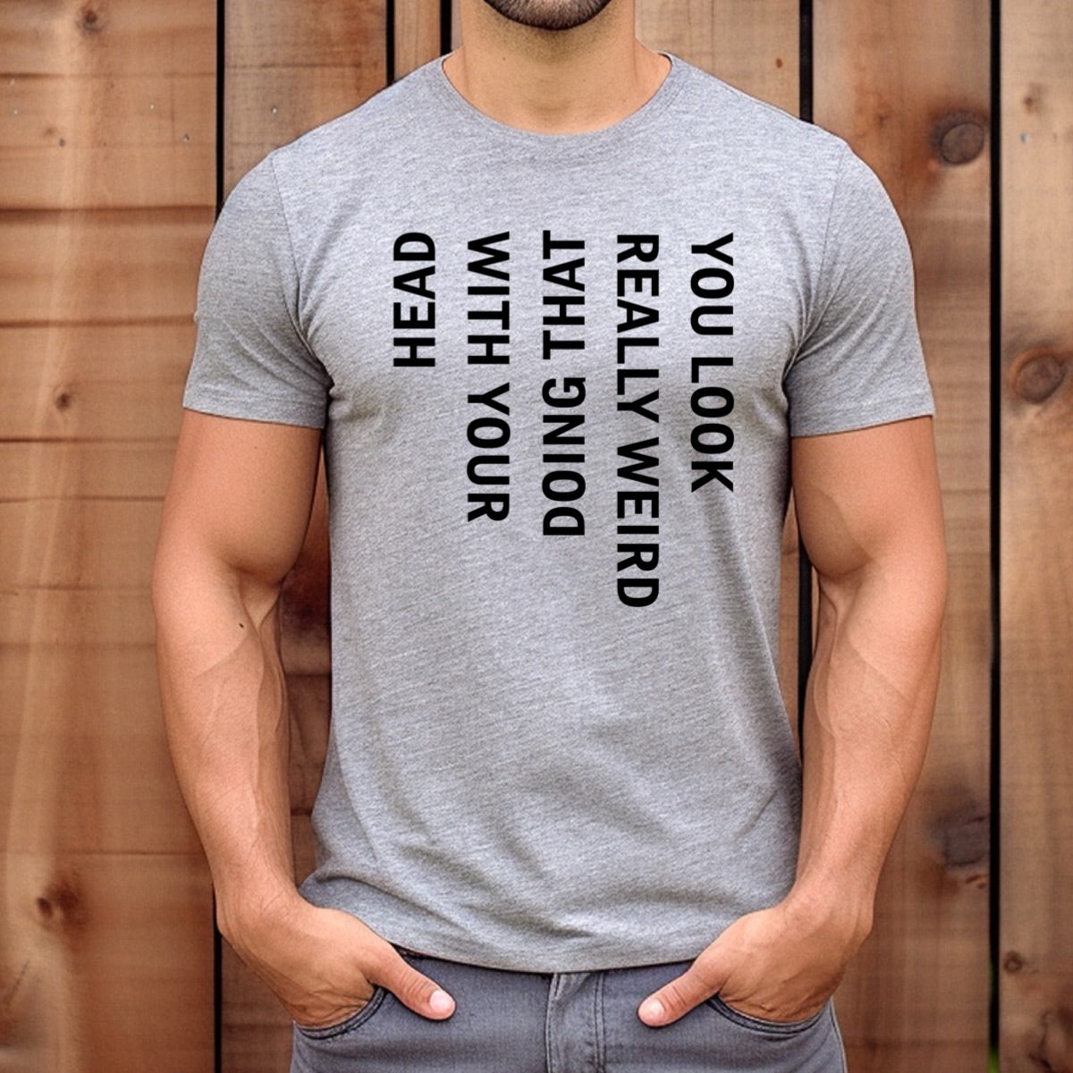 Man wearing grey crewneck t-shirt with bold vertical print you look really weird doing that with your head