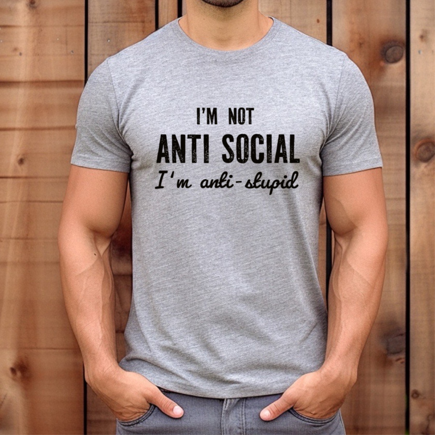 Man wearing grey crew neck t-shirt with funny quote I'm not anti social I'm anti stupid