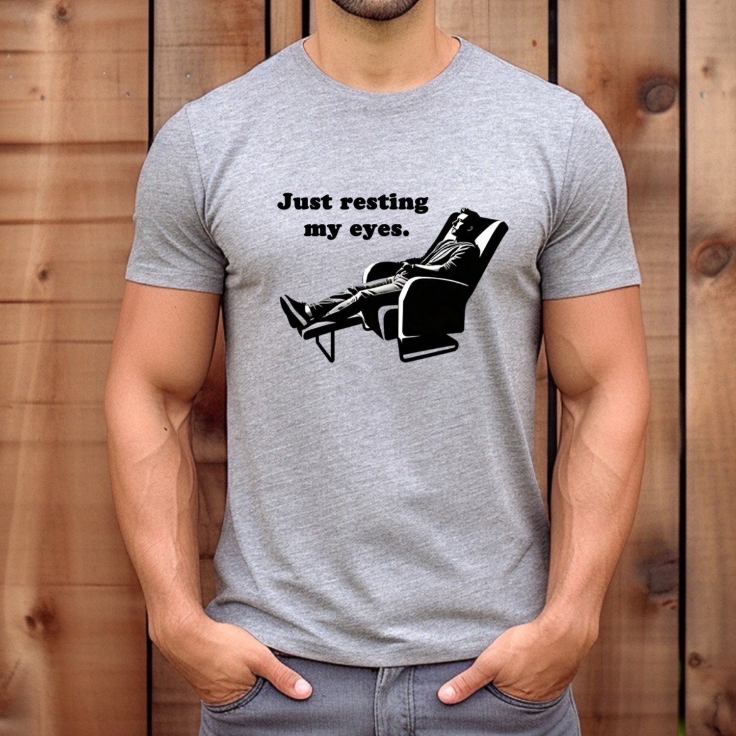 Man wearing grey t-shirt with Just resting my eyes design featuring man in chair