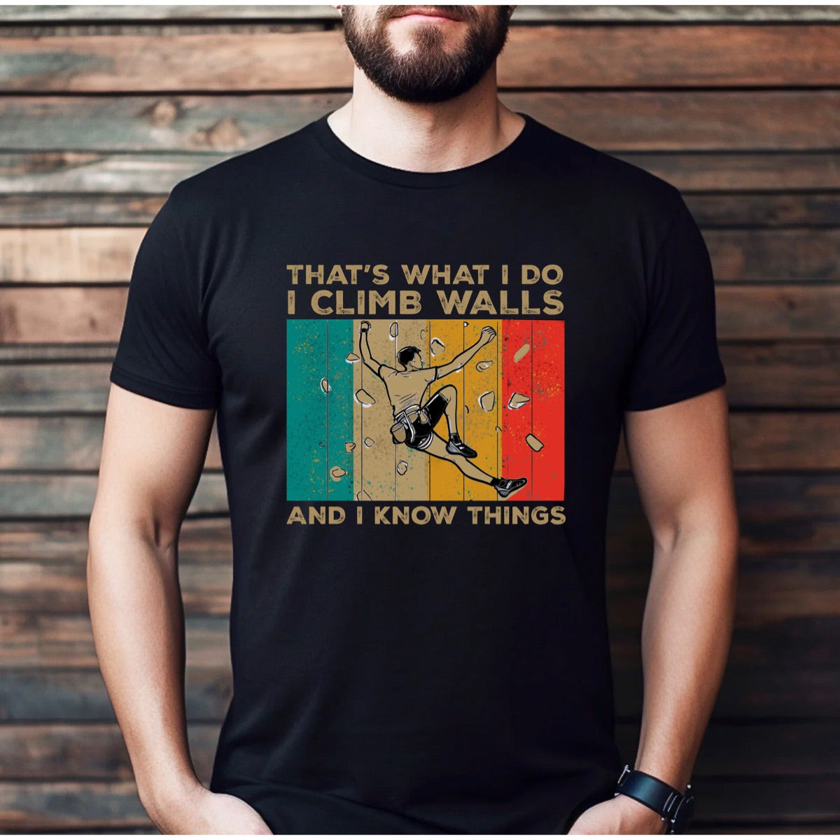 Man wearing black climbing graphic t-shirt with retro stripes and text That's What I Do I Climb Walls And I Know Things