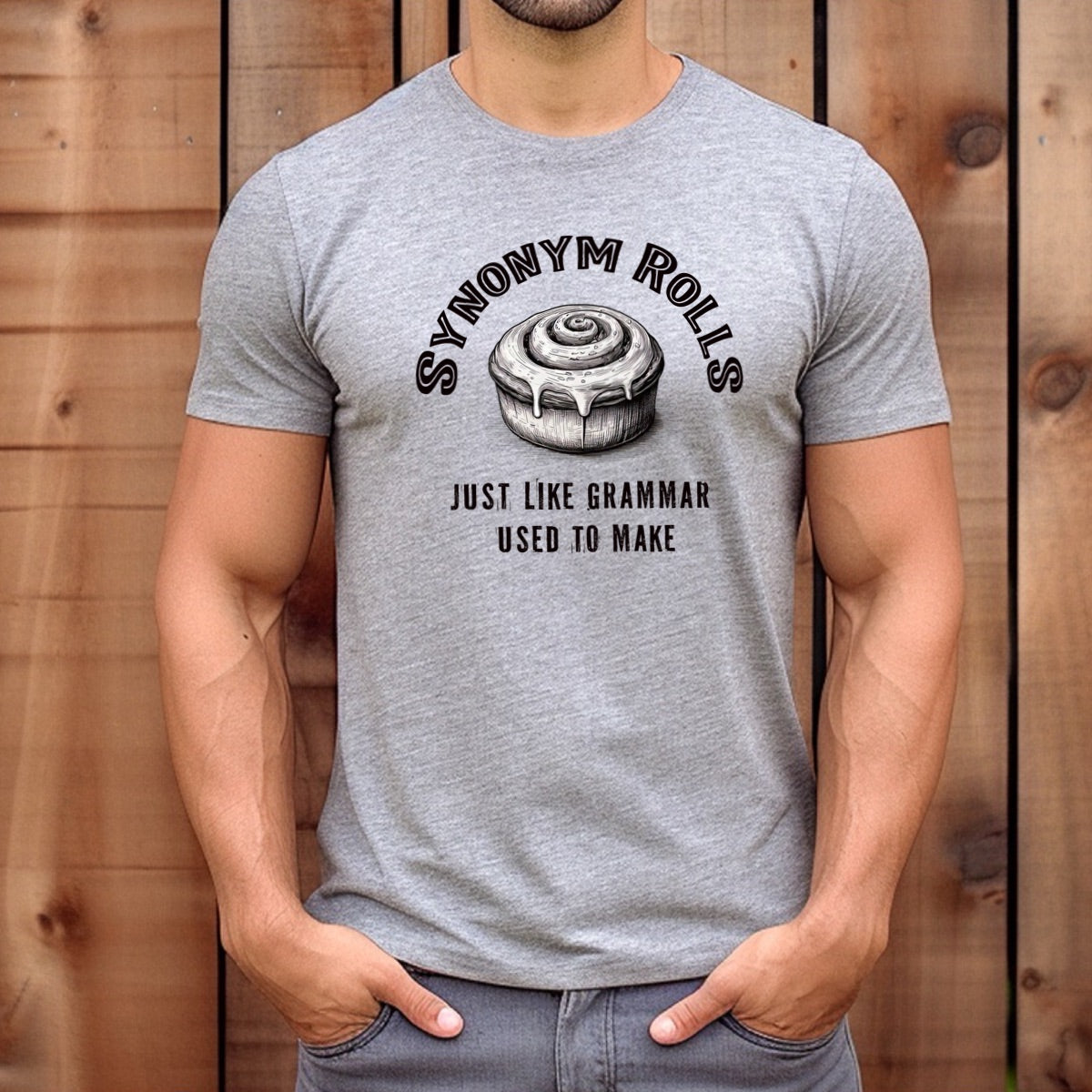 Man wearing grey synonym rolls pun t-shirt with cinnamon roll and grammar phrase design