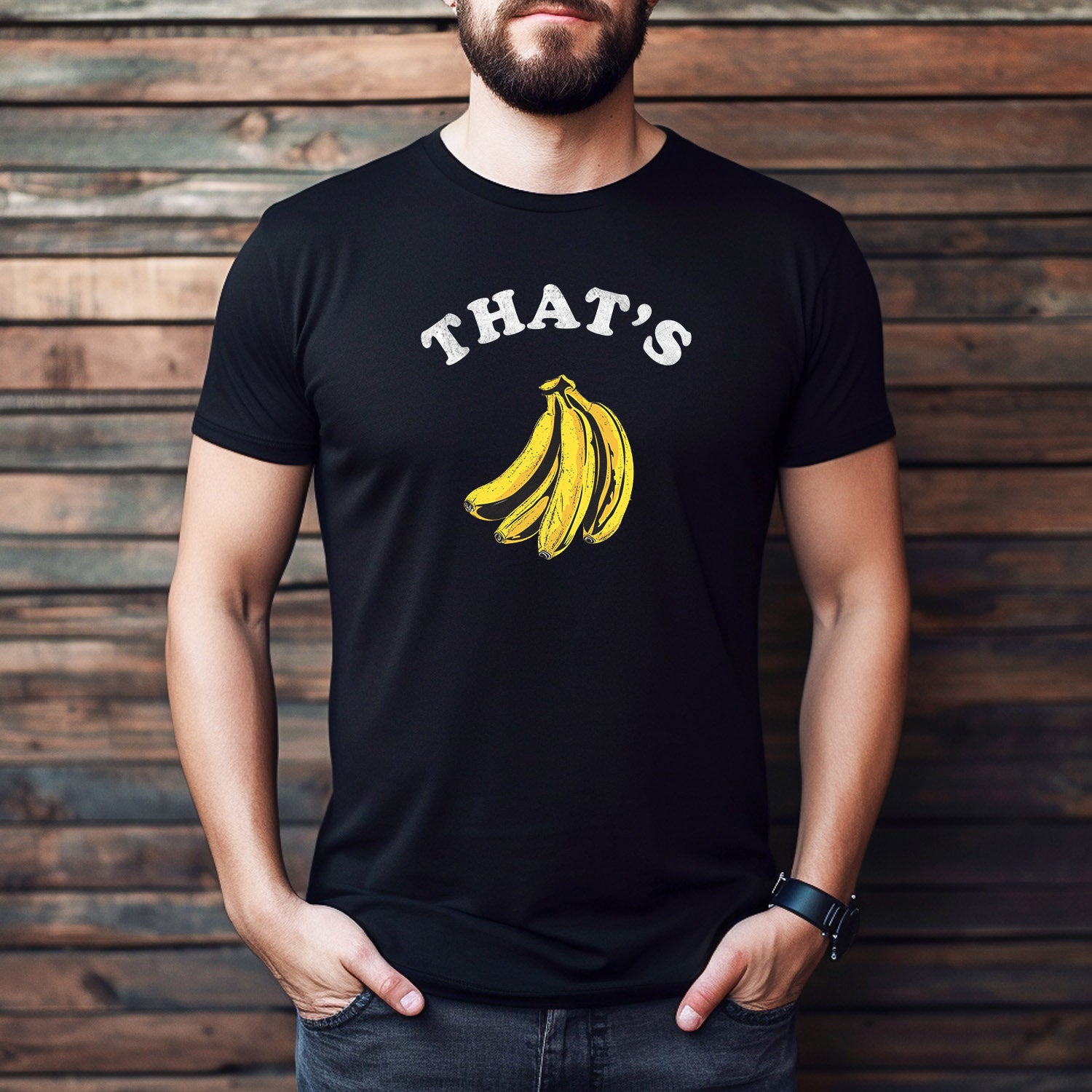 Man wearing black "That's Bananas" graphic t-shirt with yellow banana design and white bold lettering.