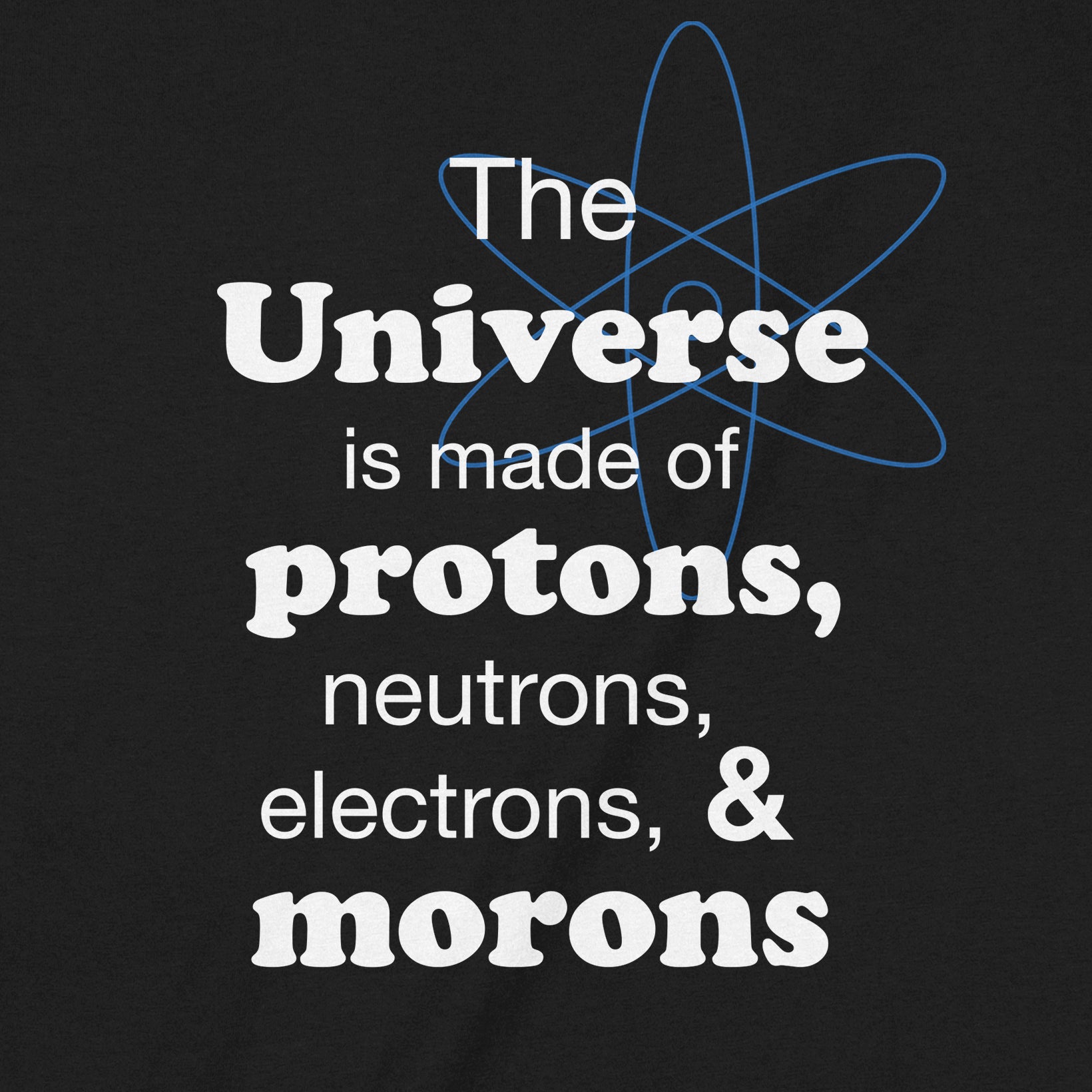 Close-up of science joke graphic tee showing text about protons, neutrons, electrons, and morons with atomic design