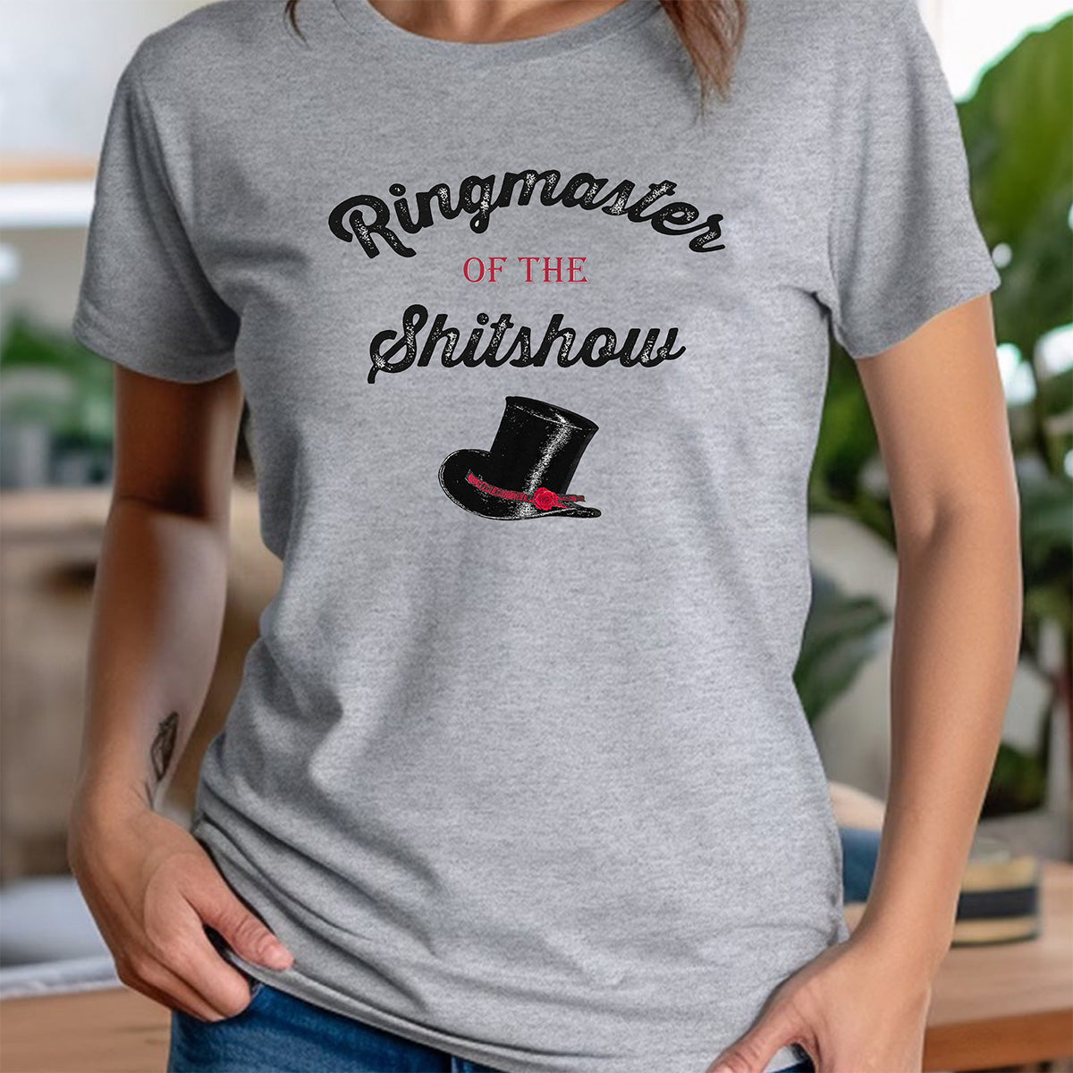 Women’s crewneck heather gray Ringmaster of the Shitshow tee with top hat graphic, casual lifestyle pose