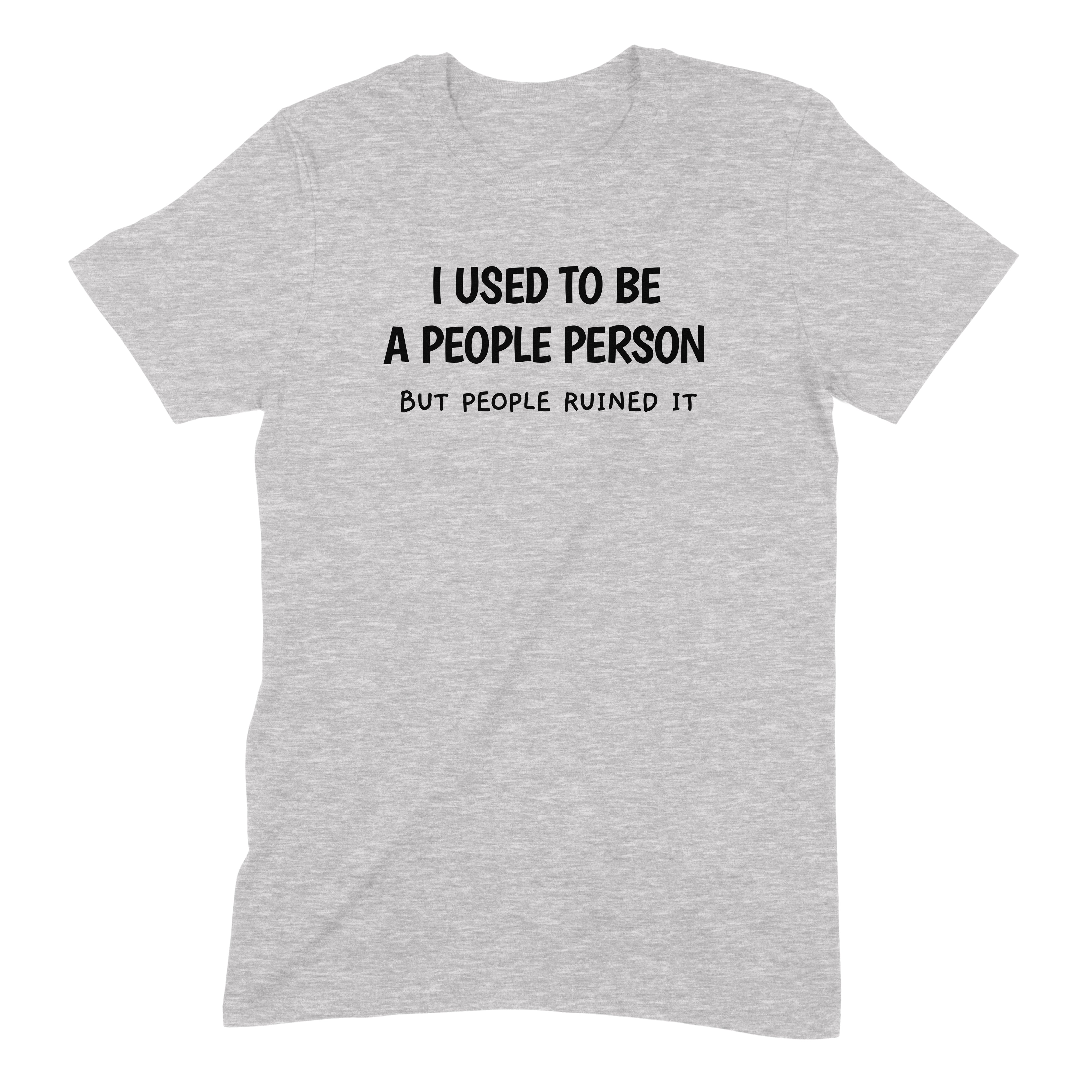 Flat lay grey t-shirt with sarcastic quote I used to be a people person but people ruined it in bold black text