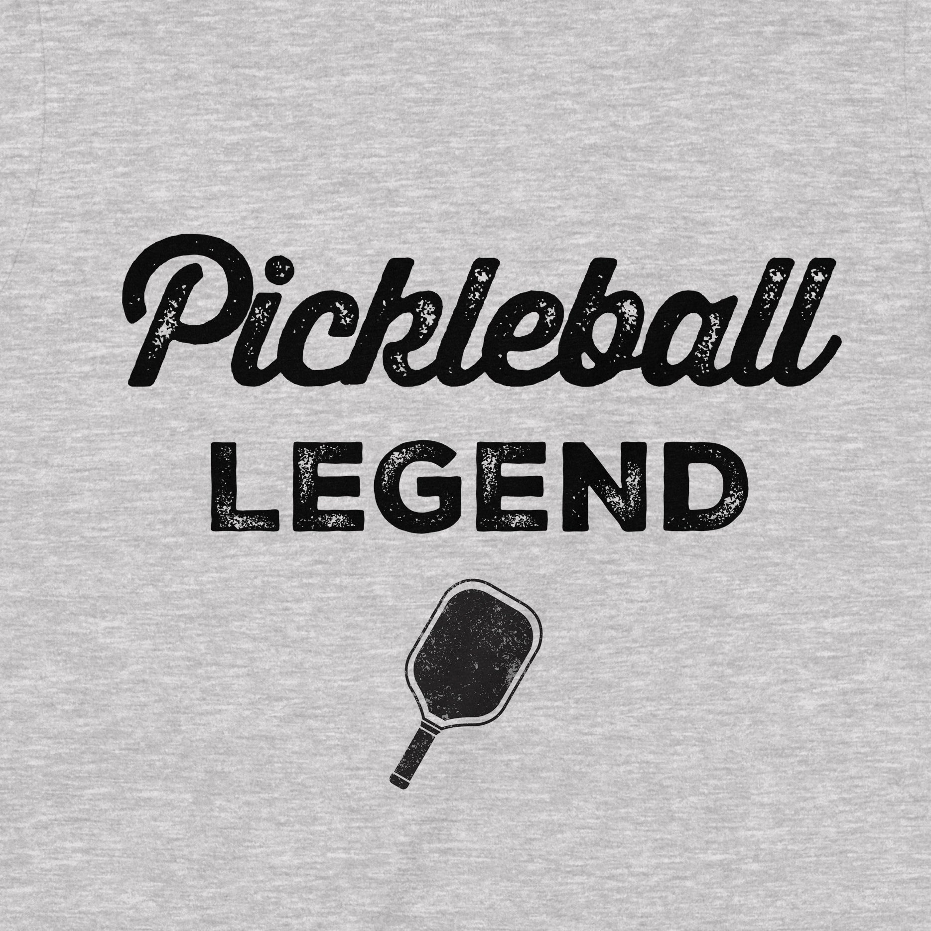Closeup of gray Pickleball Legend shirt with black distressed lettering and paddle graphic, perfect gift for pickleball lovers