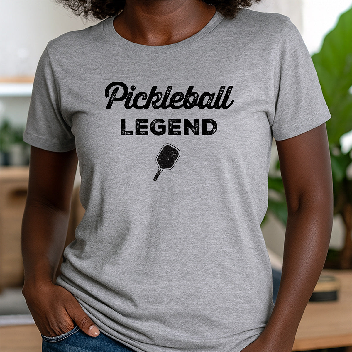 Women’s crewneck Pickleball Legend tee in gray with distressed black lettering and paddle graphic, fun gift for athletes