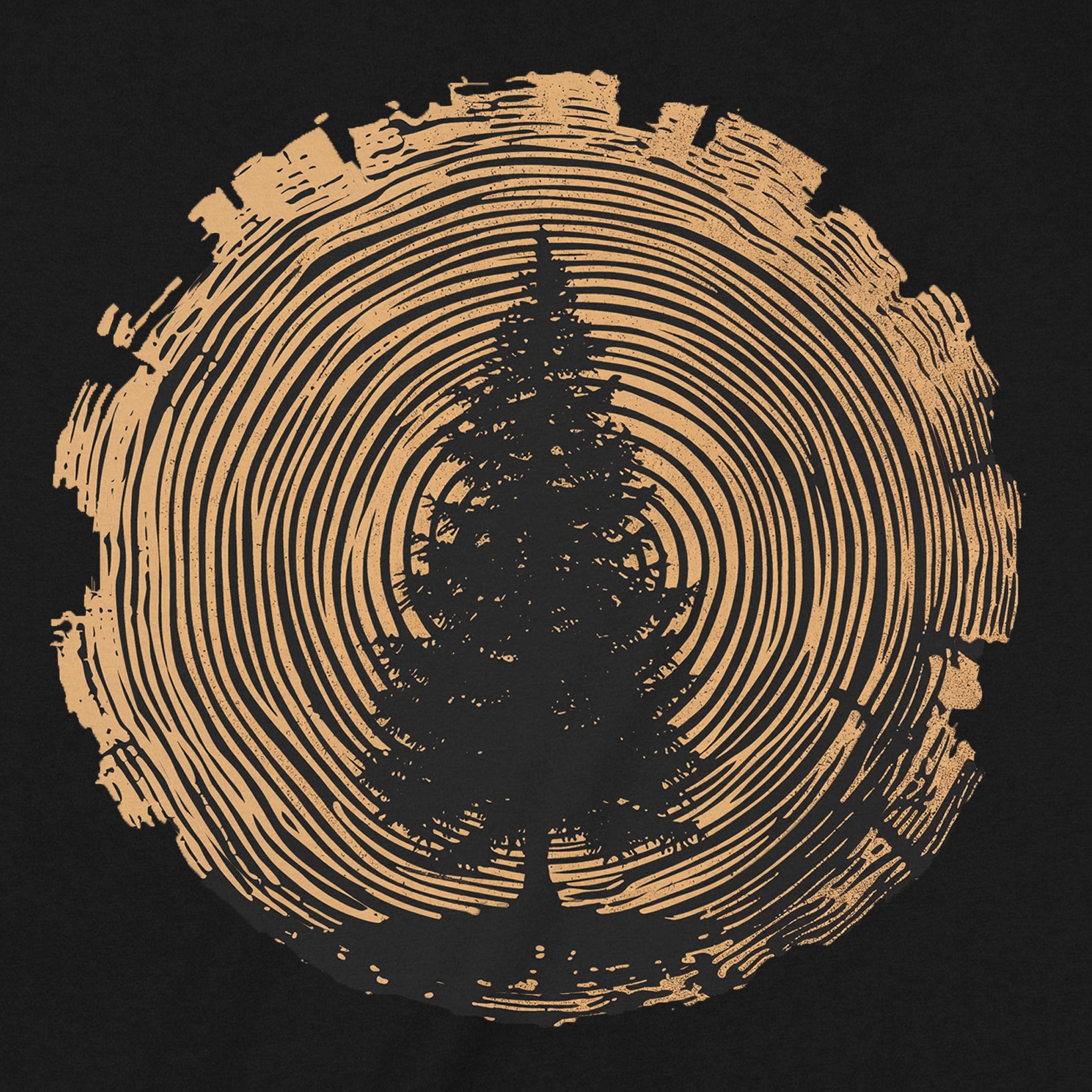 Close-up of pine tree silhouette centered in golden wood growth rings on a black tee.