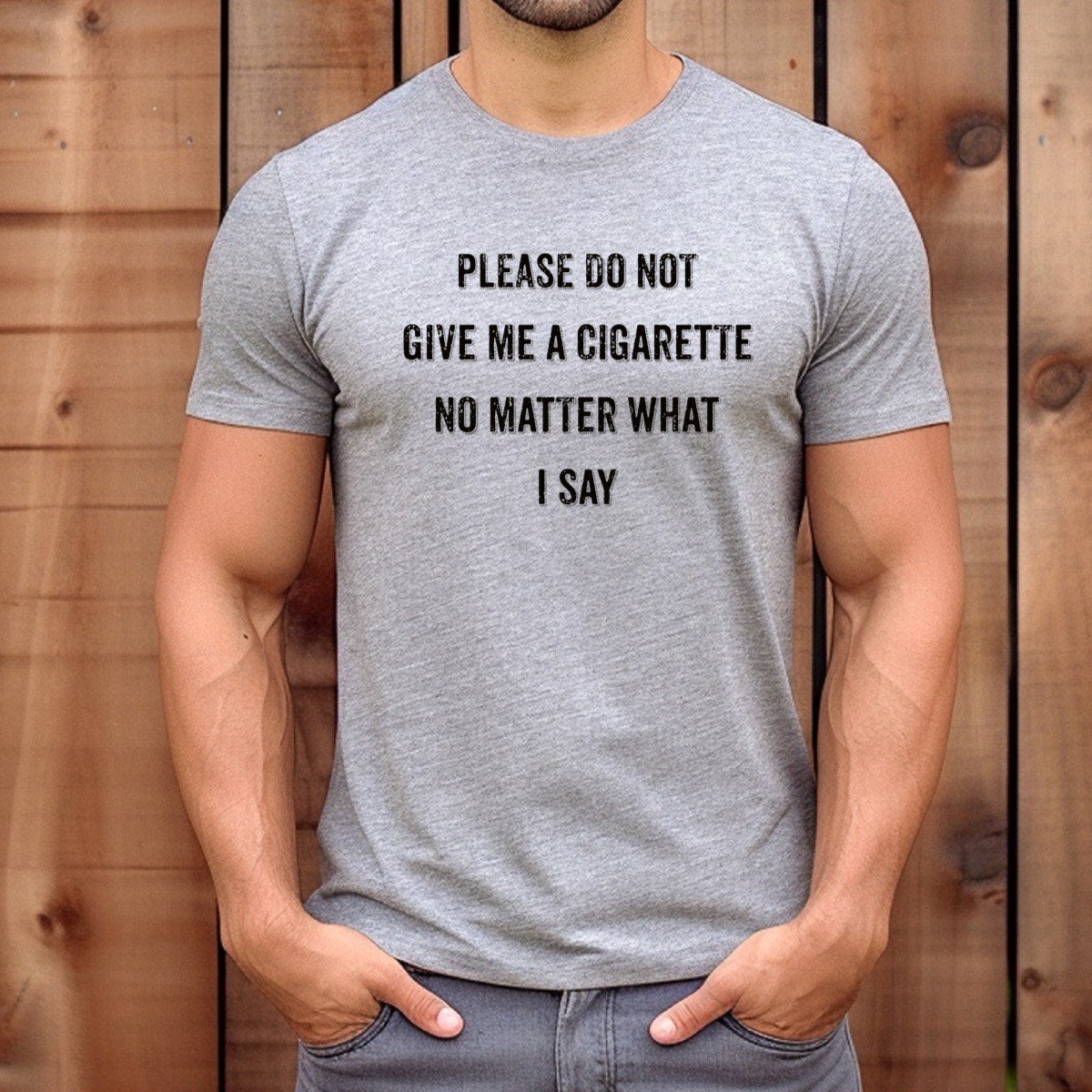 Man wearing heather gray anti-smoking t-shirt reading Please do not give me a cigarette, casual outdoor style