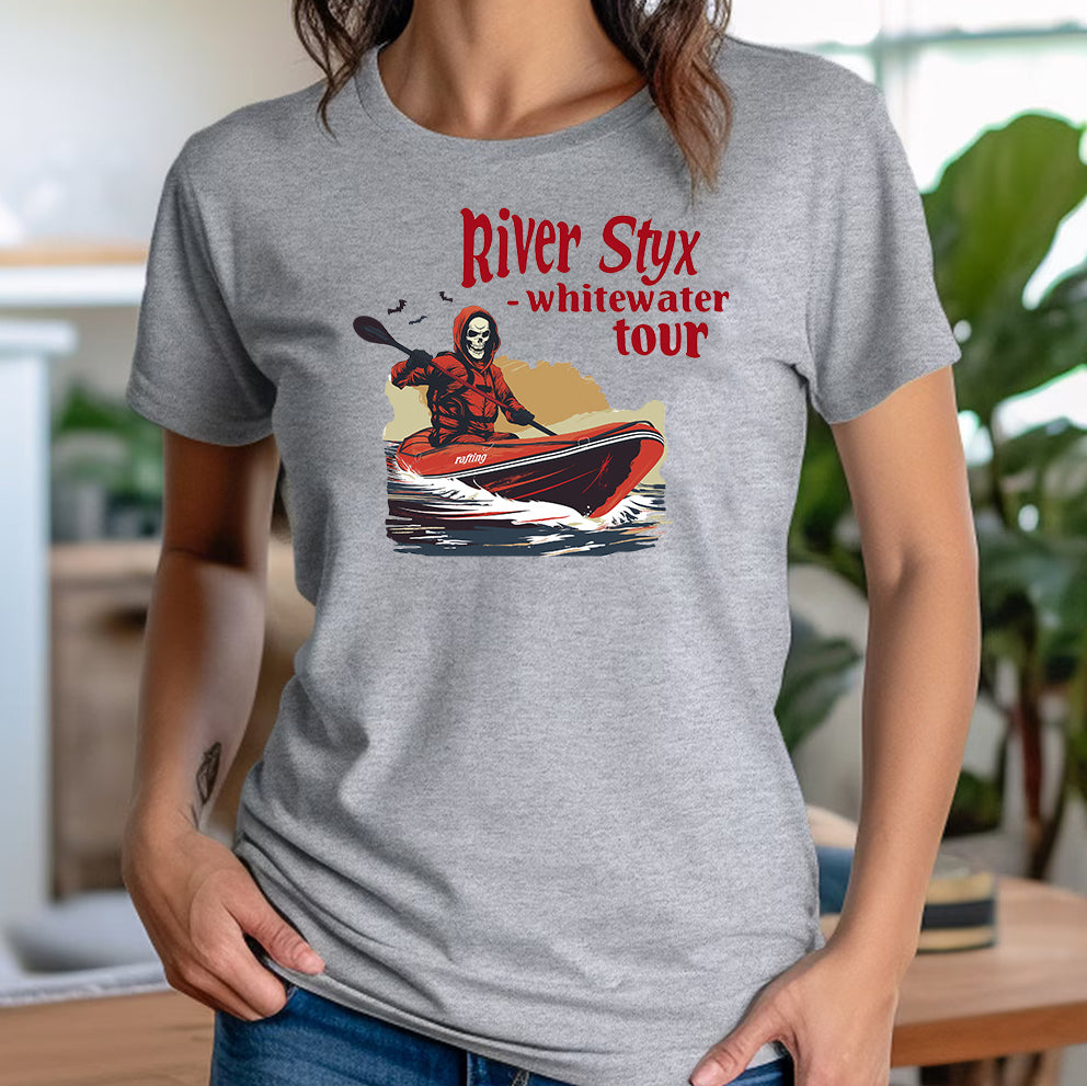 Women’s grey t-shirt with River Styx whitewater tour graphic of Grim Reaper in a kayak