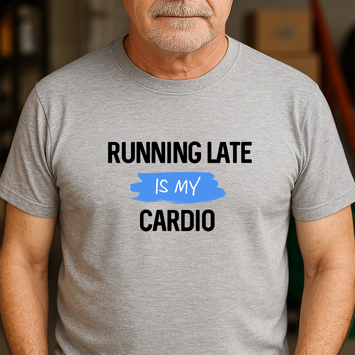 Man wearing gray crew neck t-shirt with running late is my cardio design in bold letters