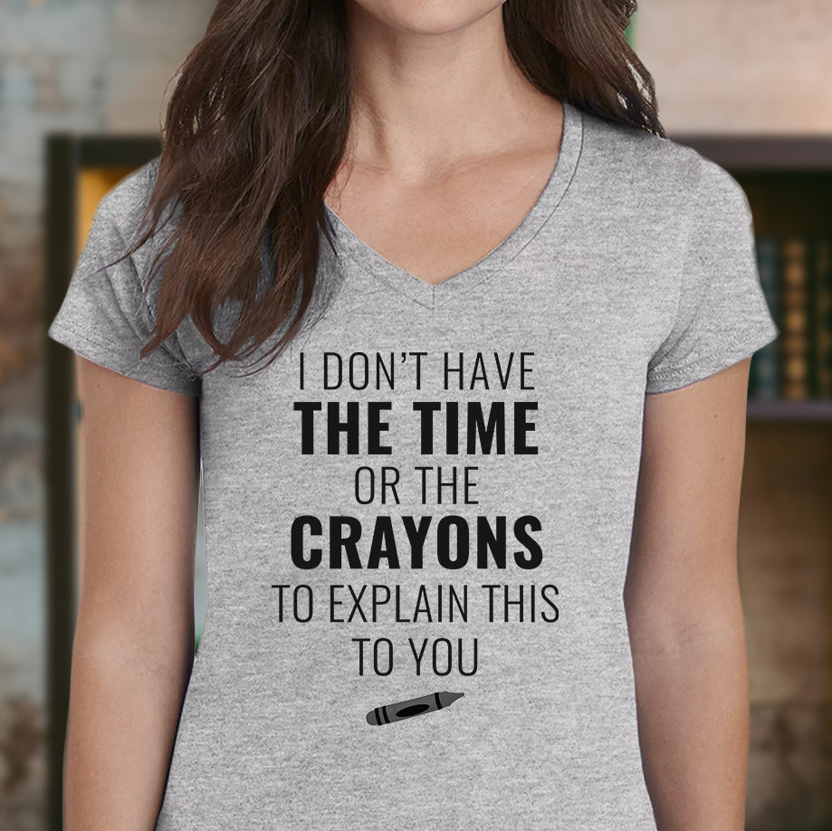 Woman in grey v-neck t-shirt with bold text I don’t have the time or the crayons to explain this to you