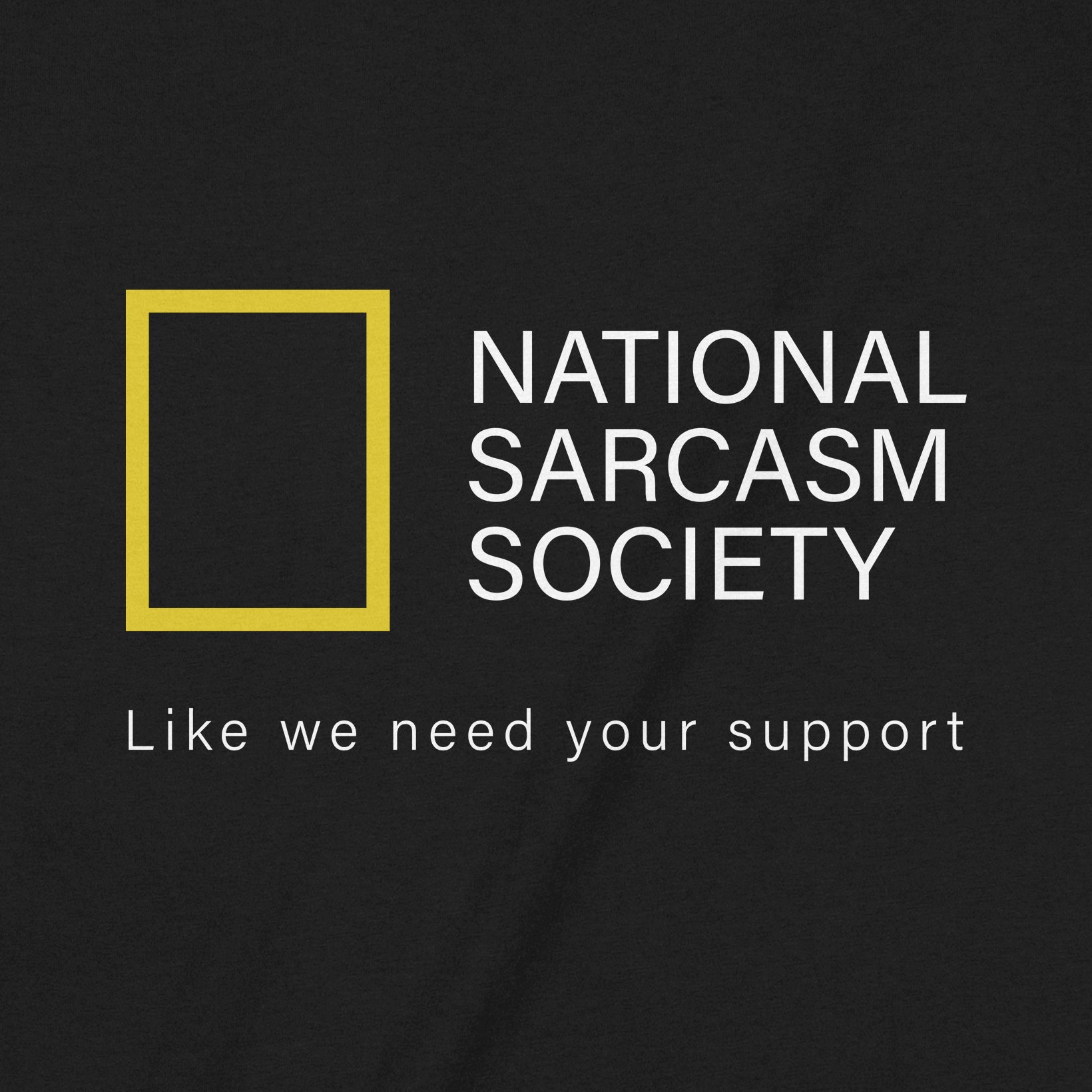 Closeup of black tee with National Sarcasm Society text and yellow square design reading Like we need your support