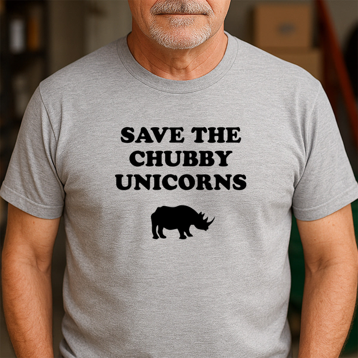 Man wearing heather gray Save the Chubby Unicorns rhino t-shirt, funny conservation graphic tee, casual fit