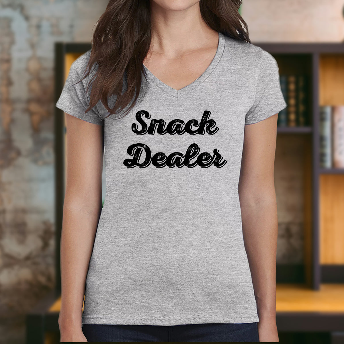 Snack Dealer graphic design on women’s grey v-neck t-shirt, funny casual tee