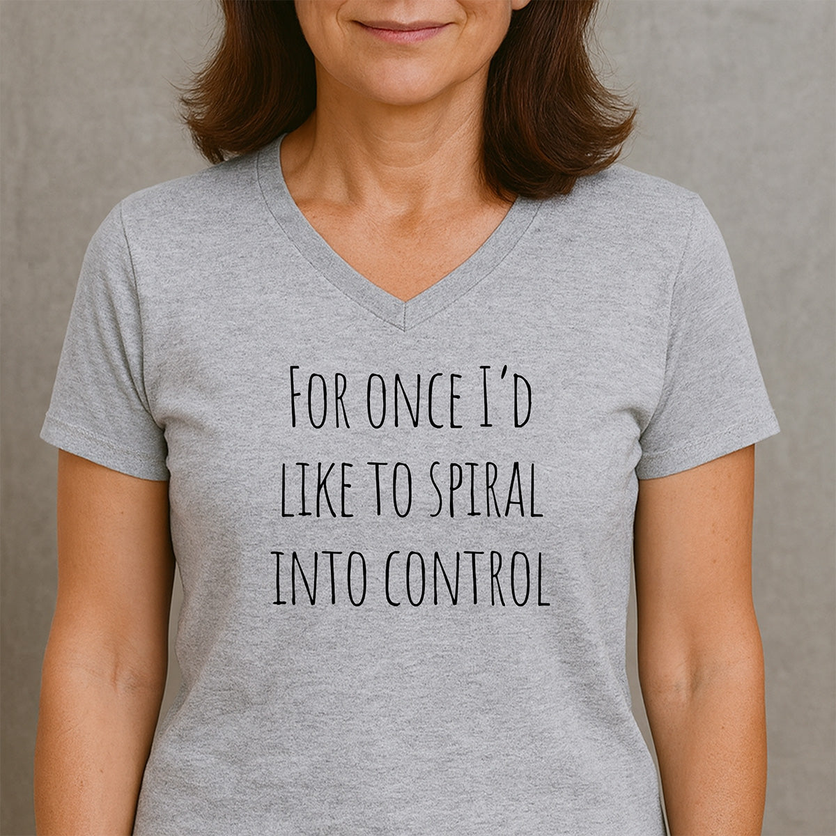 Woman wearing heather gray v-neck tee featuring For once I'd like to spiral into control funny quote
