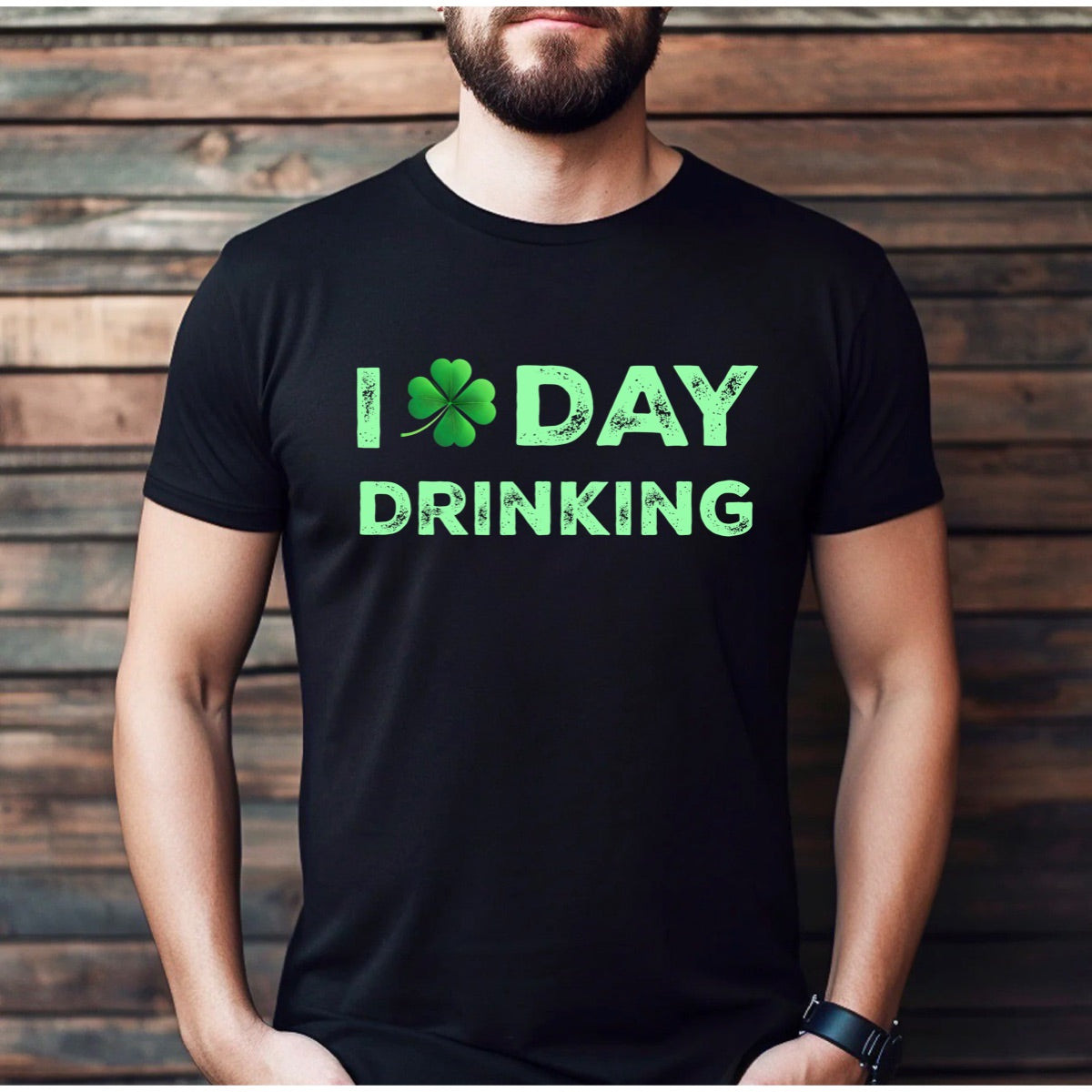 Man wearing black St. Patrick's Day shirt with green shamrock and I Day Drinking design