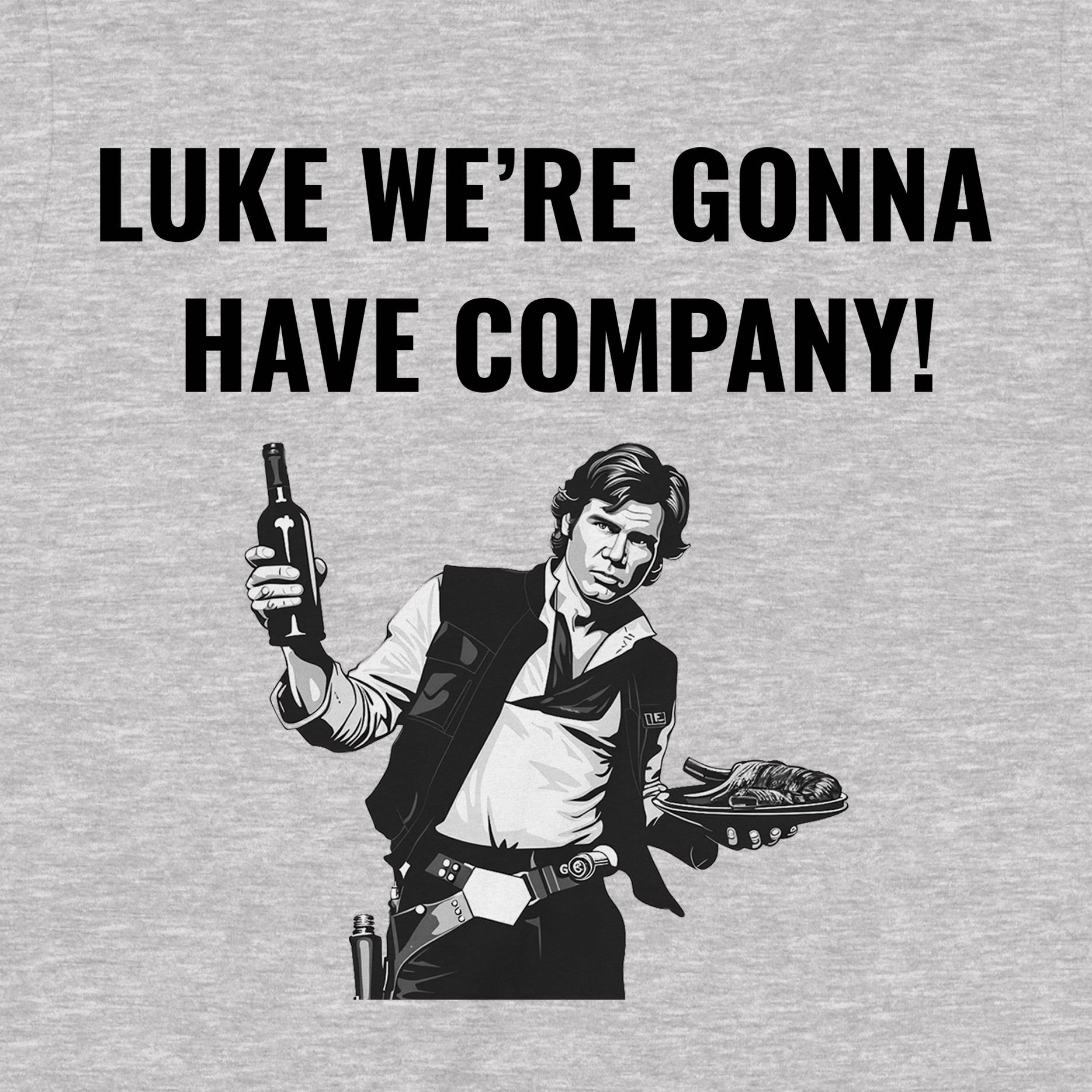 Close-up of graphic design on grey T-shirt with Han Solo illustration and the quote “Luke we’re gonna have company!”.
