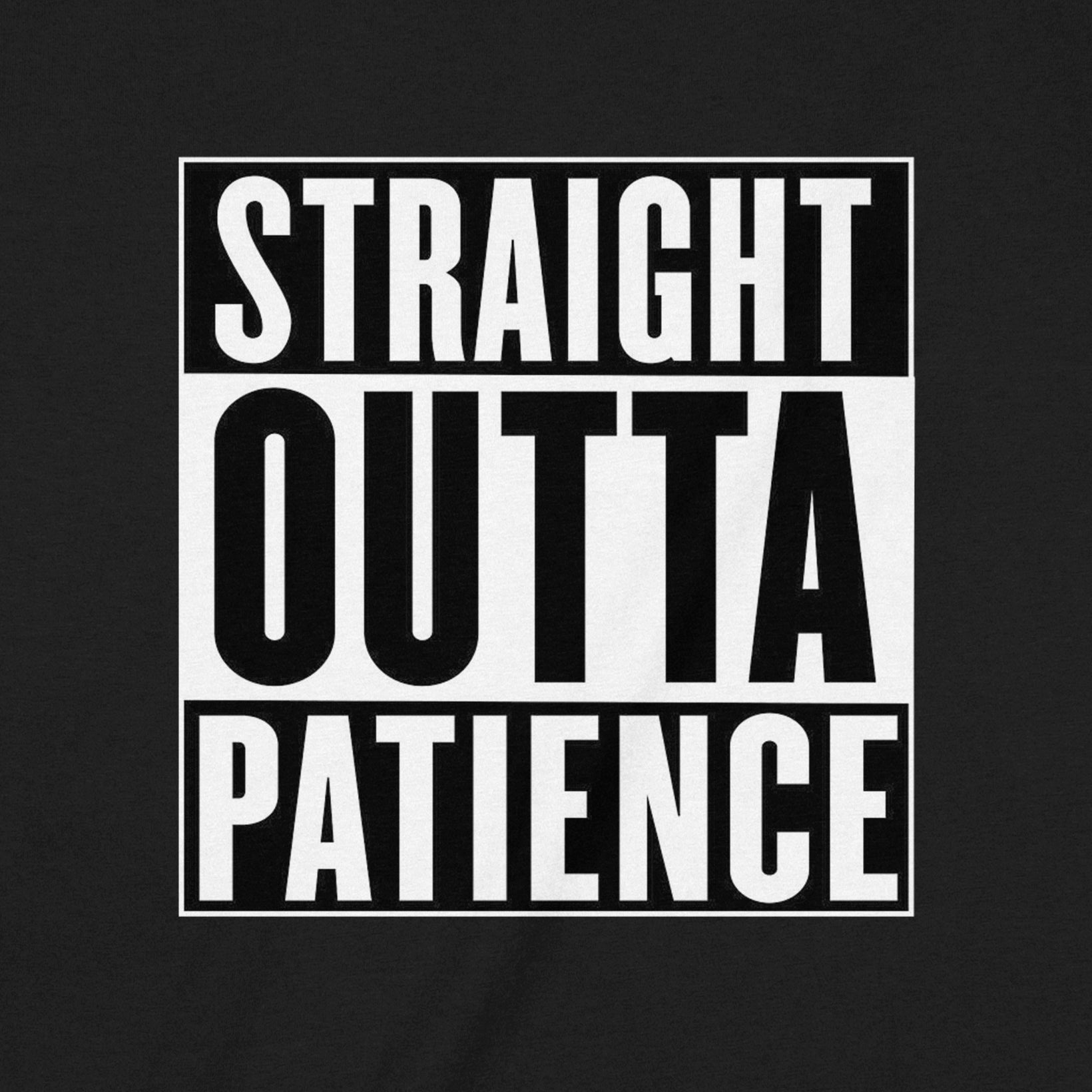 Closeup of black shirt featuring bold graphic text Straight Outta Patience in white block design