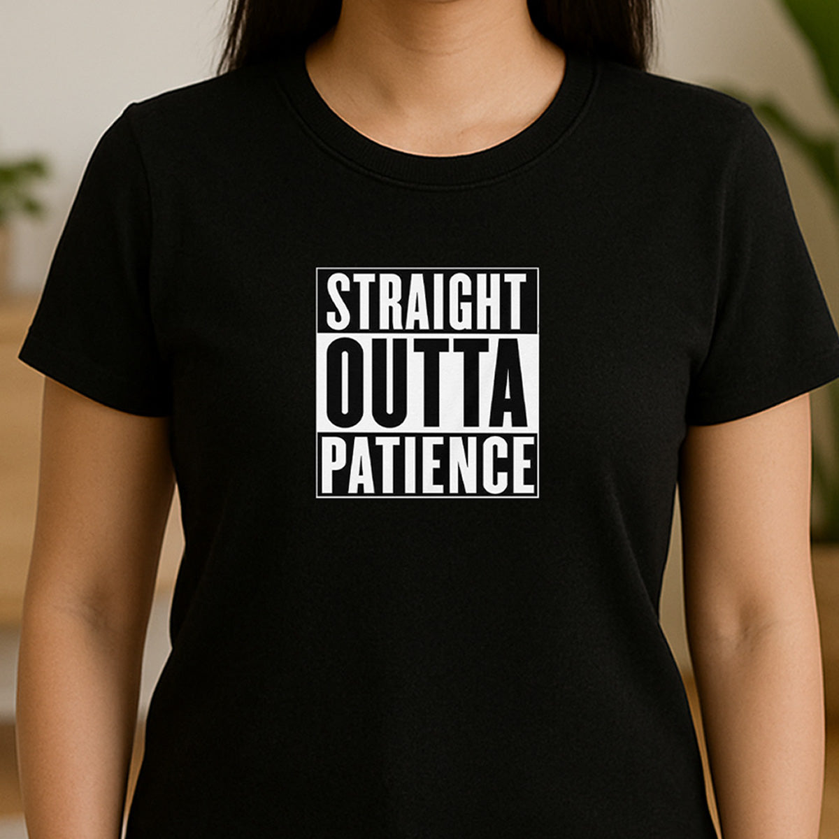 Woman in black crew neck t-shirt with bold white text Straight Outta Patience