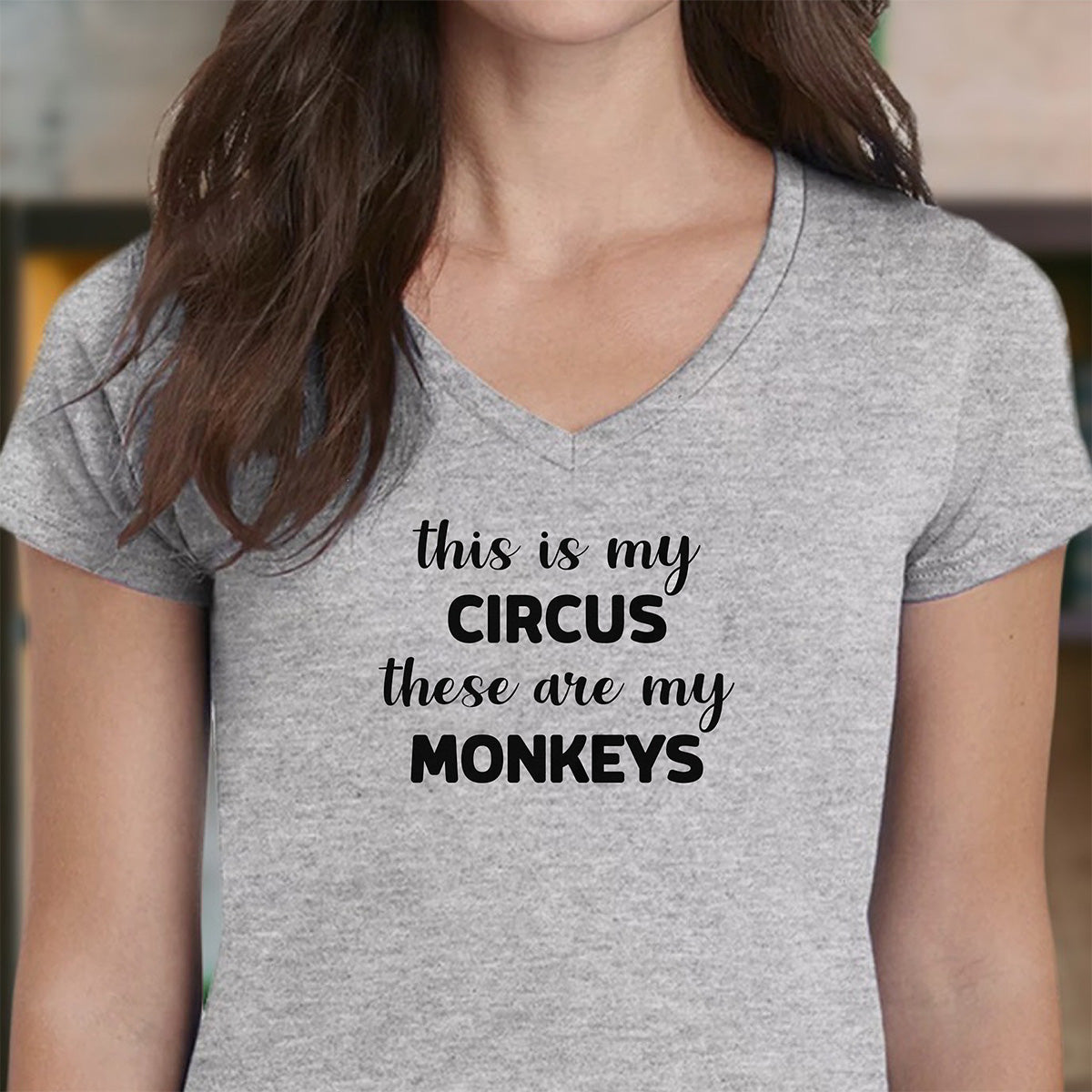 Grey women’s v-neck t-shirt with the printed phrase This Is My Circus These Are My Monkeys