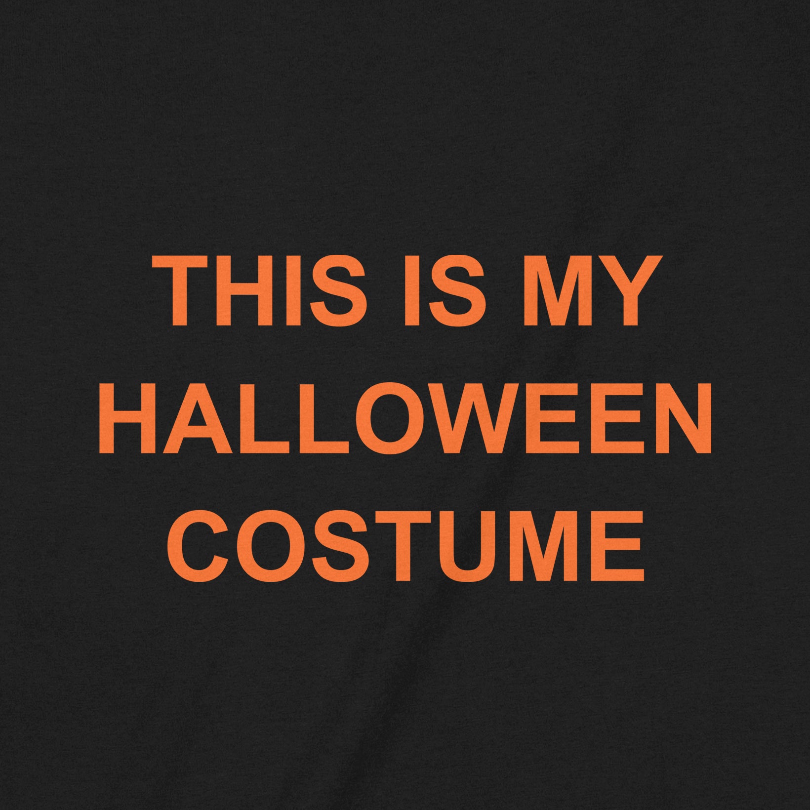 Closeup of black shirt with funny halloween text design this is my halloween costume in orange