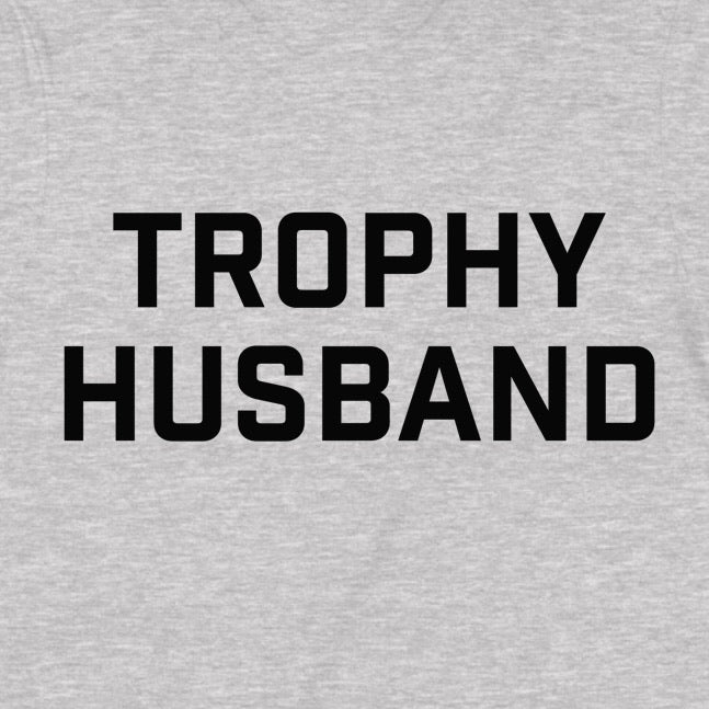 Closeup of gray t-shirt showing bold black Trophy Husband lettering