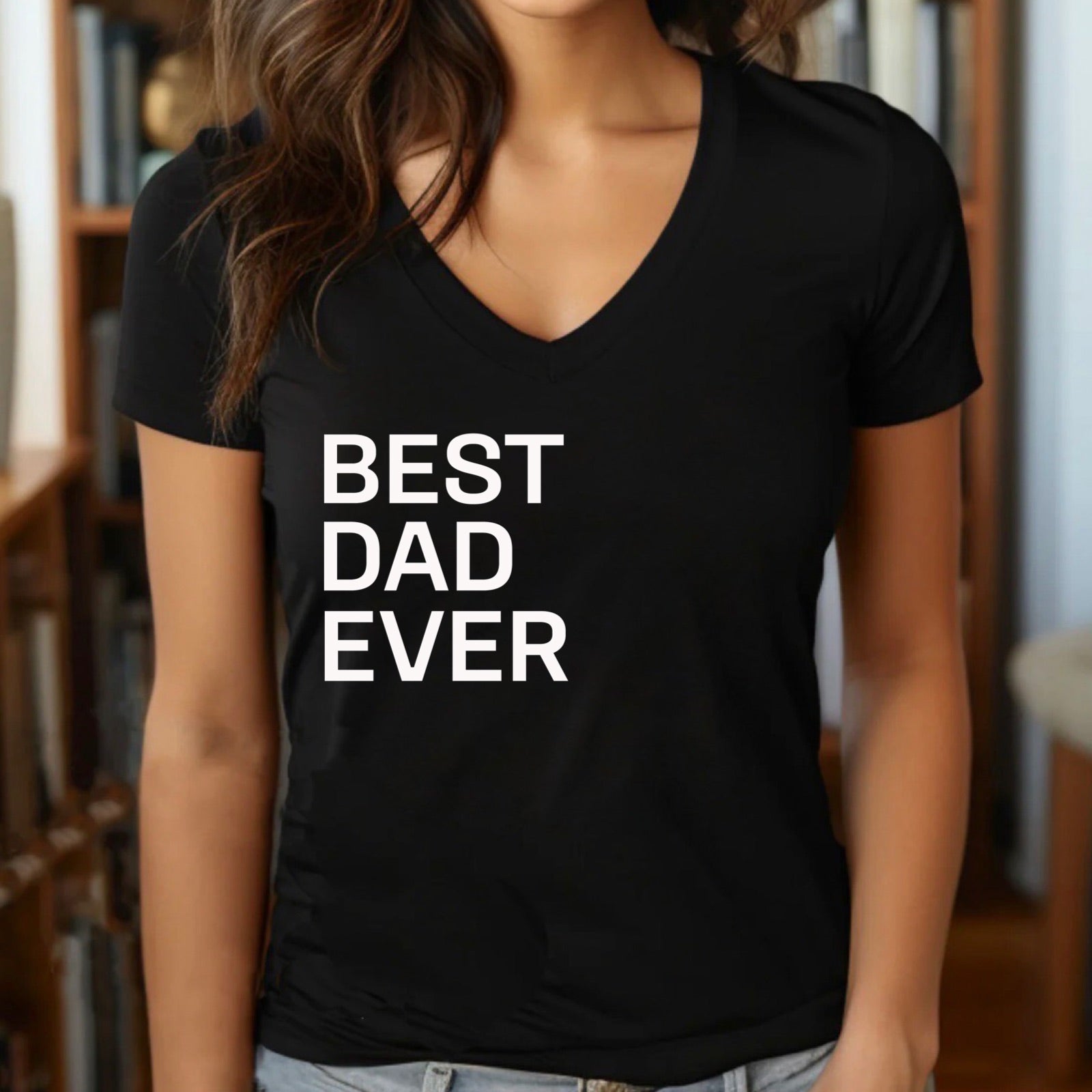 Woman wearing black v-neck t-shirt with bold white Best Husband Ever text, stylish gift tee