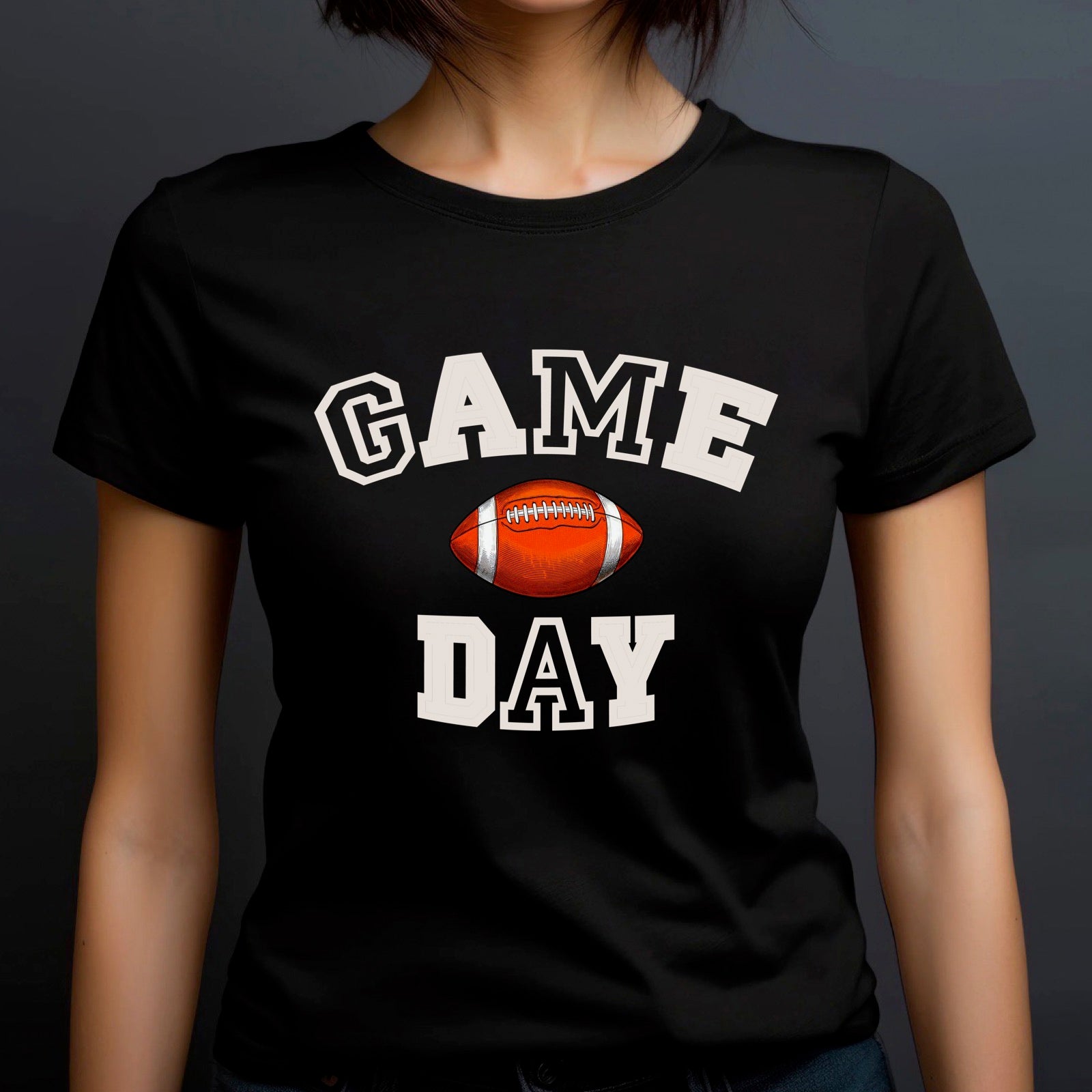 Woman in crew neck black t-shirt with Game Day text and football design