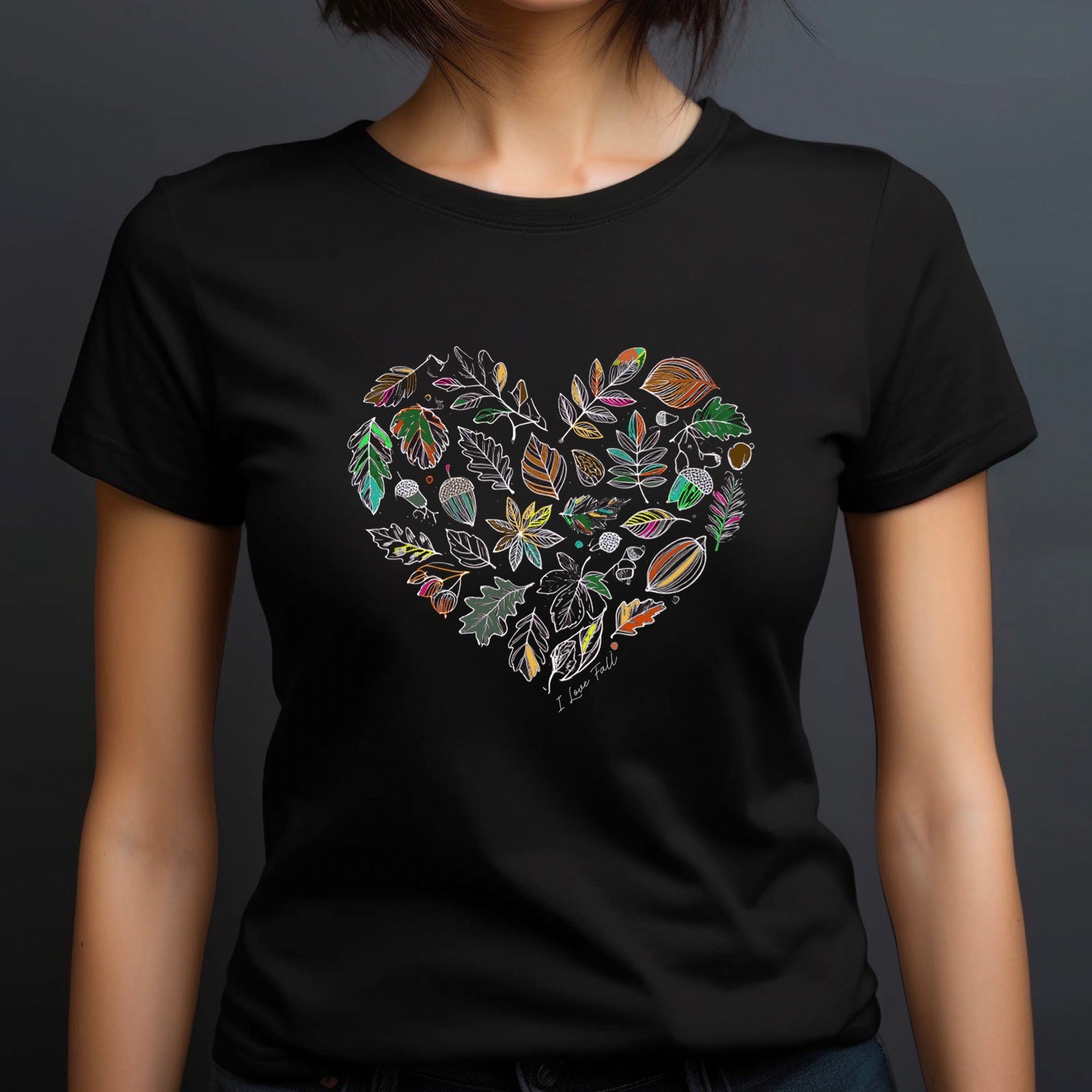 Woman in crew neck black t-shirt featuring heart-shaped fall leaf design