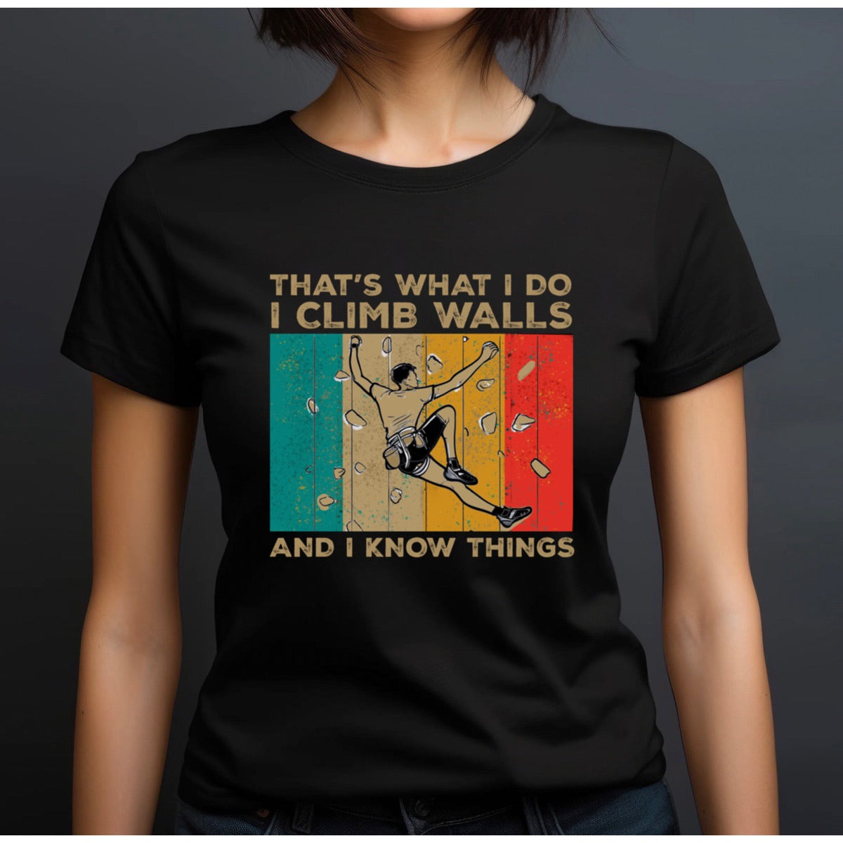 Woman in crewneck black climbing t-shirt with retro stripes and bold text That's What I Do I Climb Walls And I Know Things