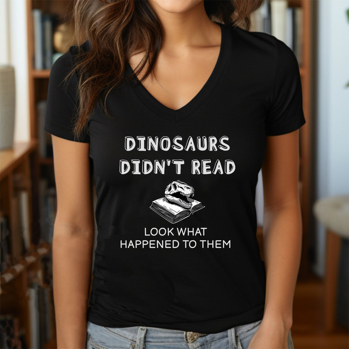 Woman in black crew neck tee featuring Dinosaurs Didn’t Read text and dinosaur skull on book design