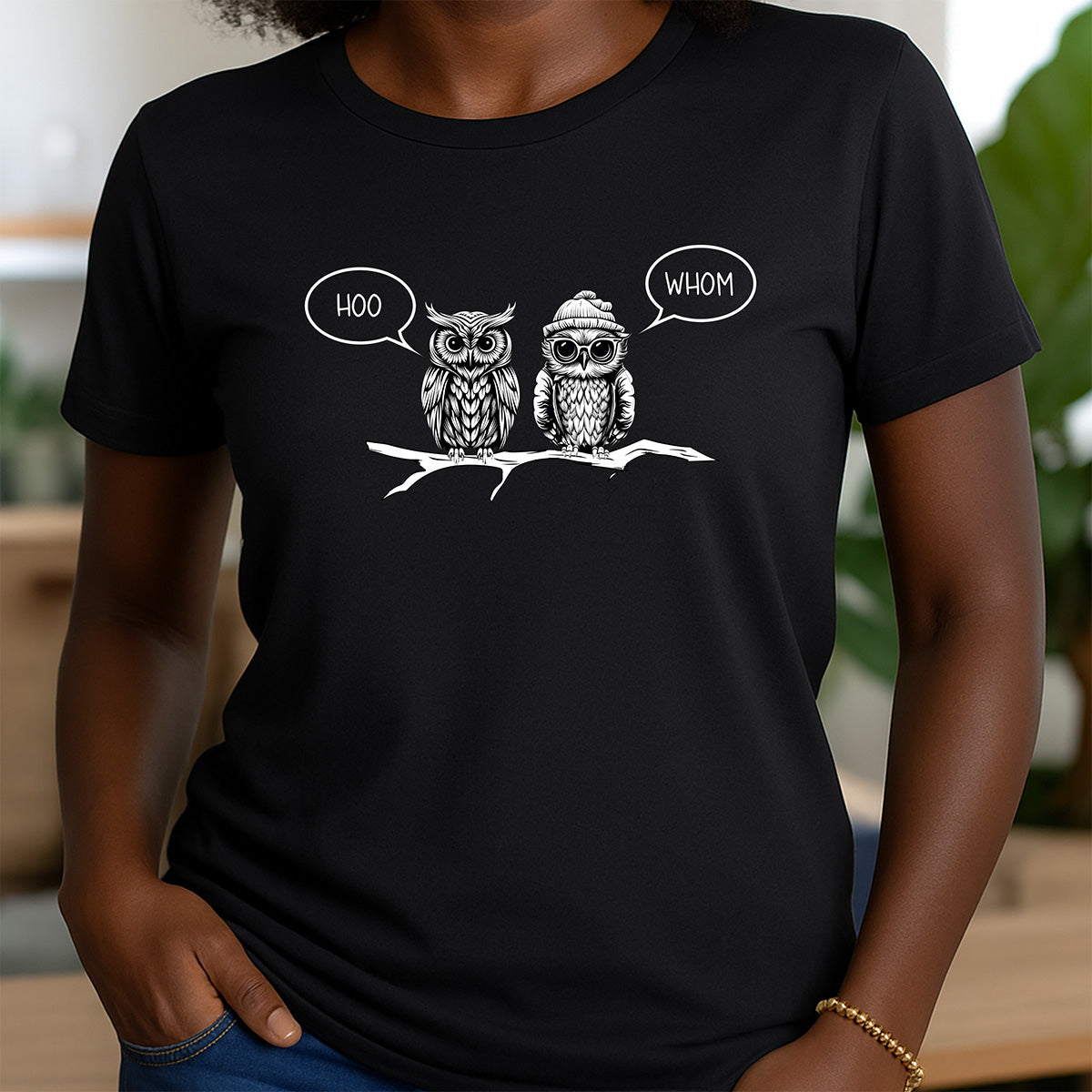 Woman wearing black crewneck shirt with owl design and text hoo and whom, funny grammar t-shirt