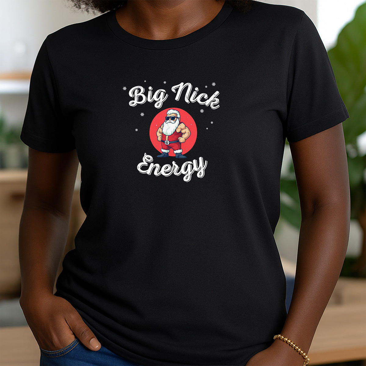 Woman in crewneck black Big Nick Energy Santa t-shirt with festive cartoon Santa design