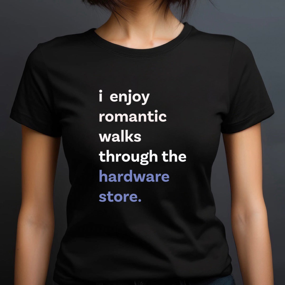 Woman in crew neck black t-shirt with text i enjoy romantic walks through the hardware store in white and blue
