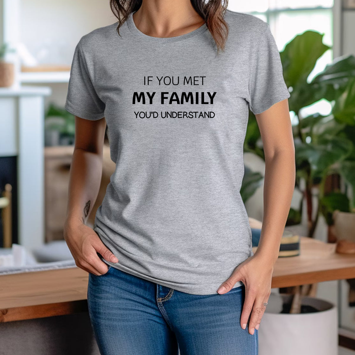 Woman wearing grey crewneck t-shirt with witty saying If You Met My Family You’d Understand