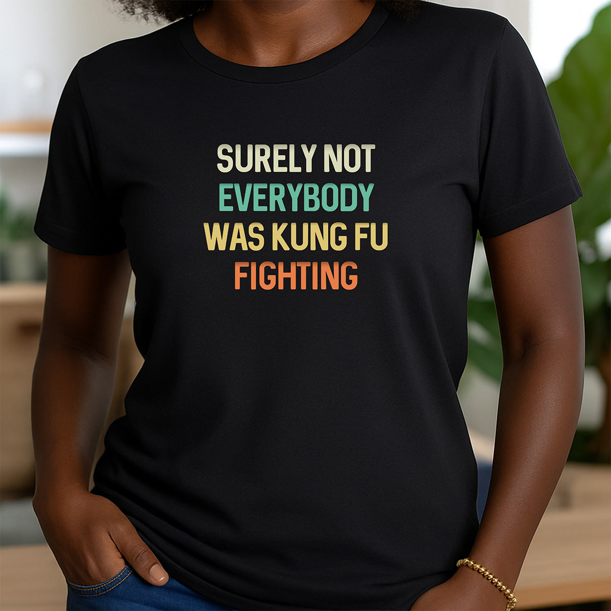 Woman in black crewneck t-shirt with multicolor retro text Surely Not Everybody Was Kung Fu Fighting