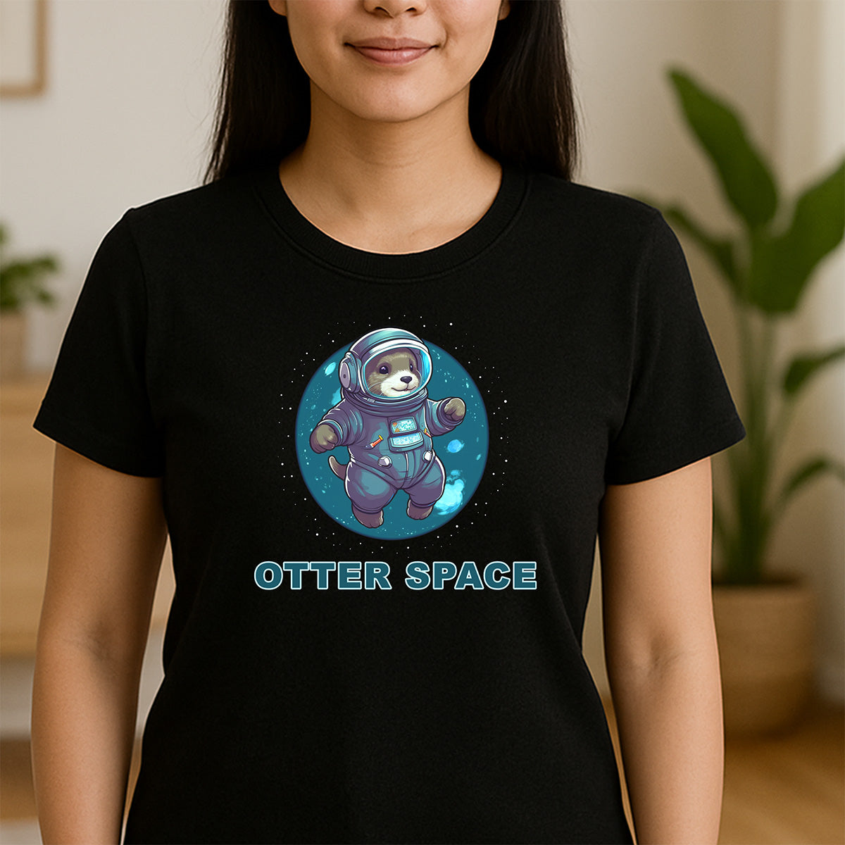 Woman wearing black crewneck tee with cute otter astronaut and OTTER SPACE text, soft cotton look.