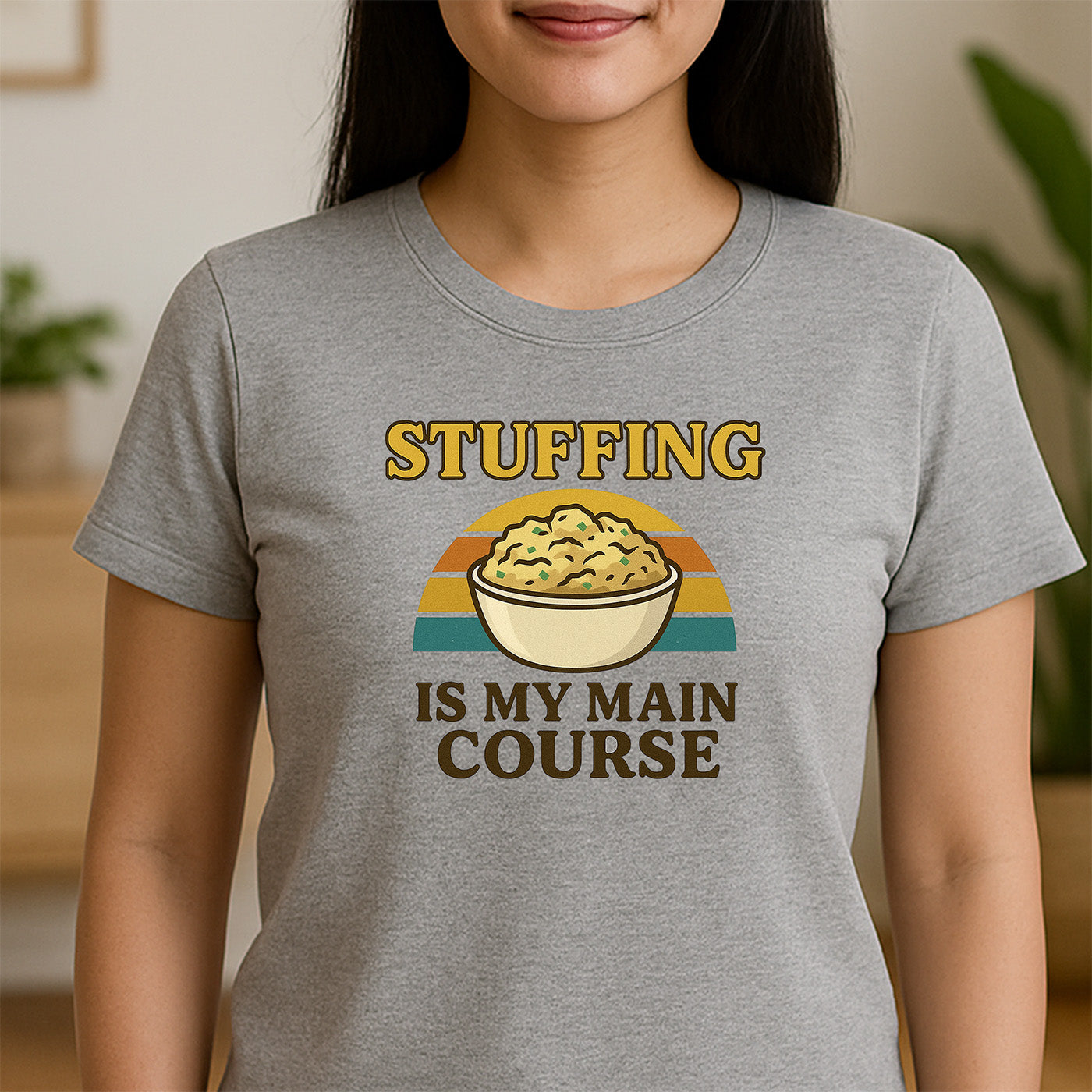 woman in gray crew neck t-shirt with bowl of stuffing and text stuffing is my main course retro design