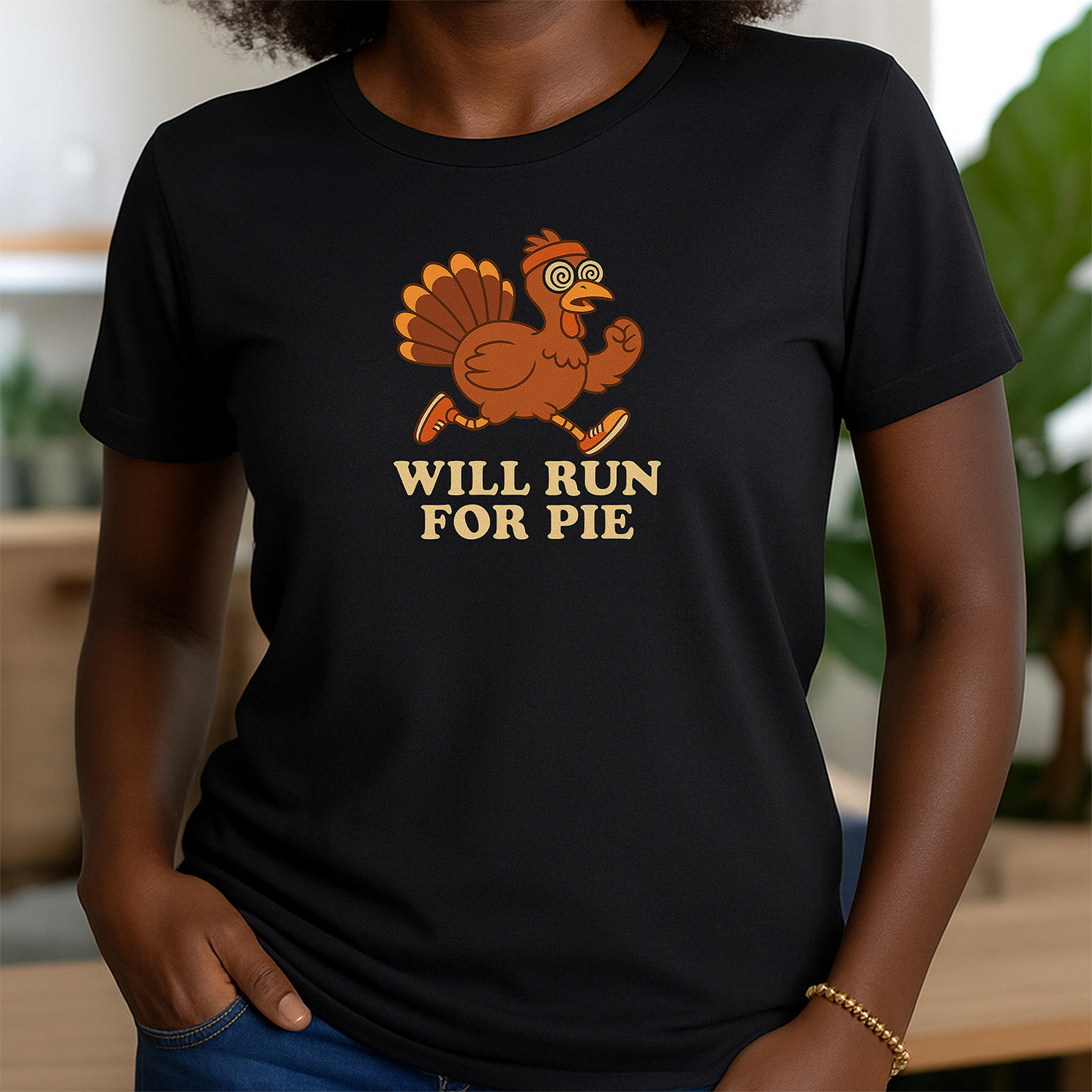 woman in black crew neck t-shirt featuring cartoon turkey running and text will run for pie
