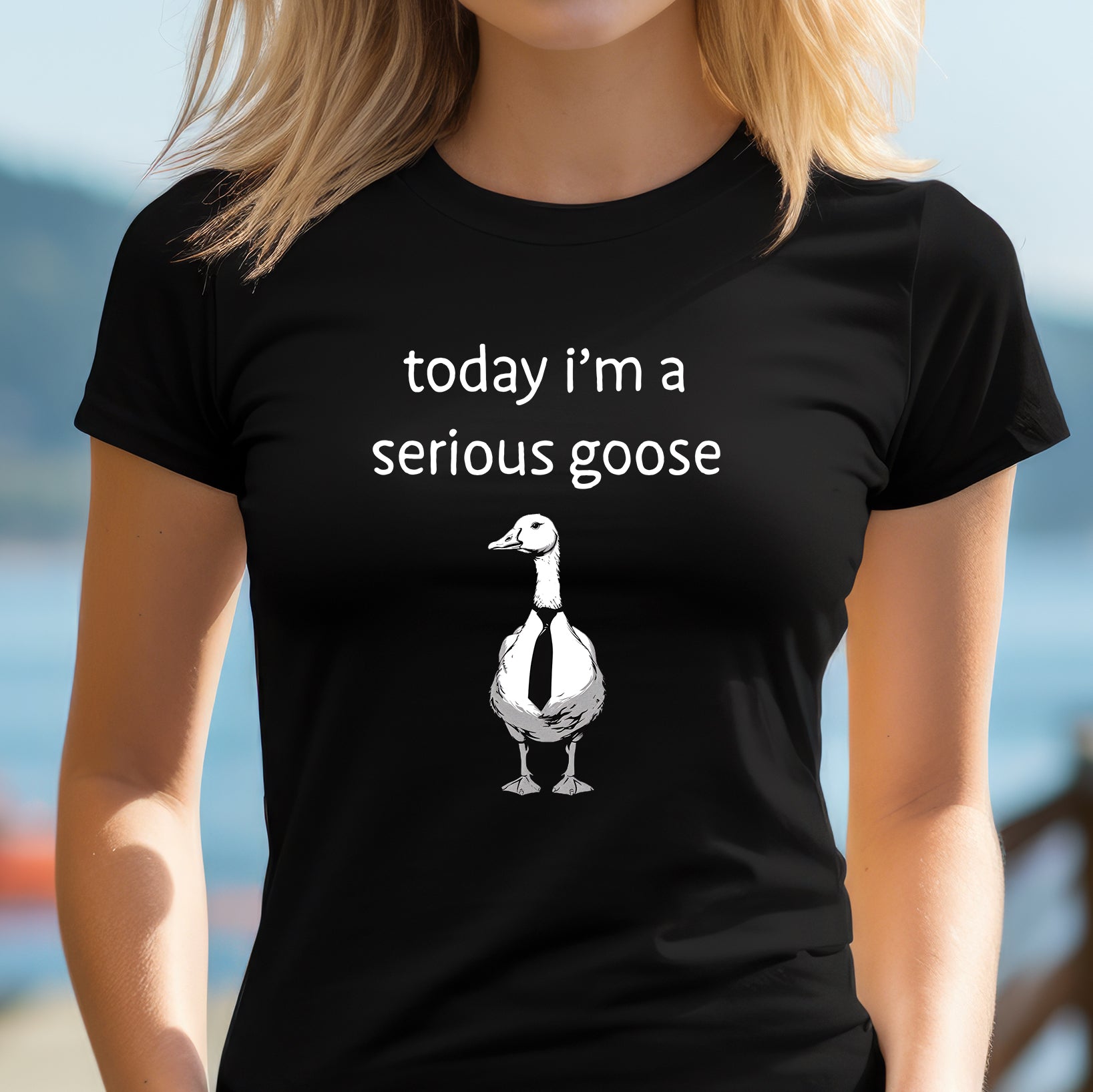 Woman outdoors wearing a fitted black today I’m a serious goose T-shirt with goose in a tie – quirky novelty shirt