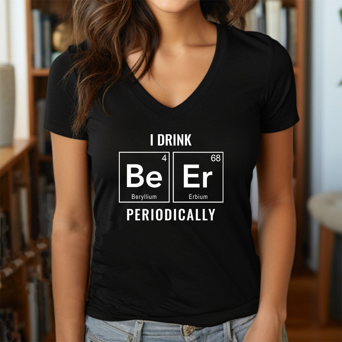 Woman wearing v-neck black t-shirt with nerdy periodic table beer design and text "I drink beer periodically."