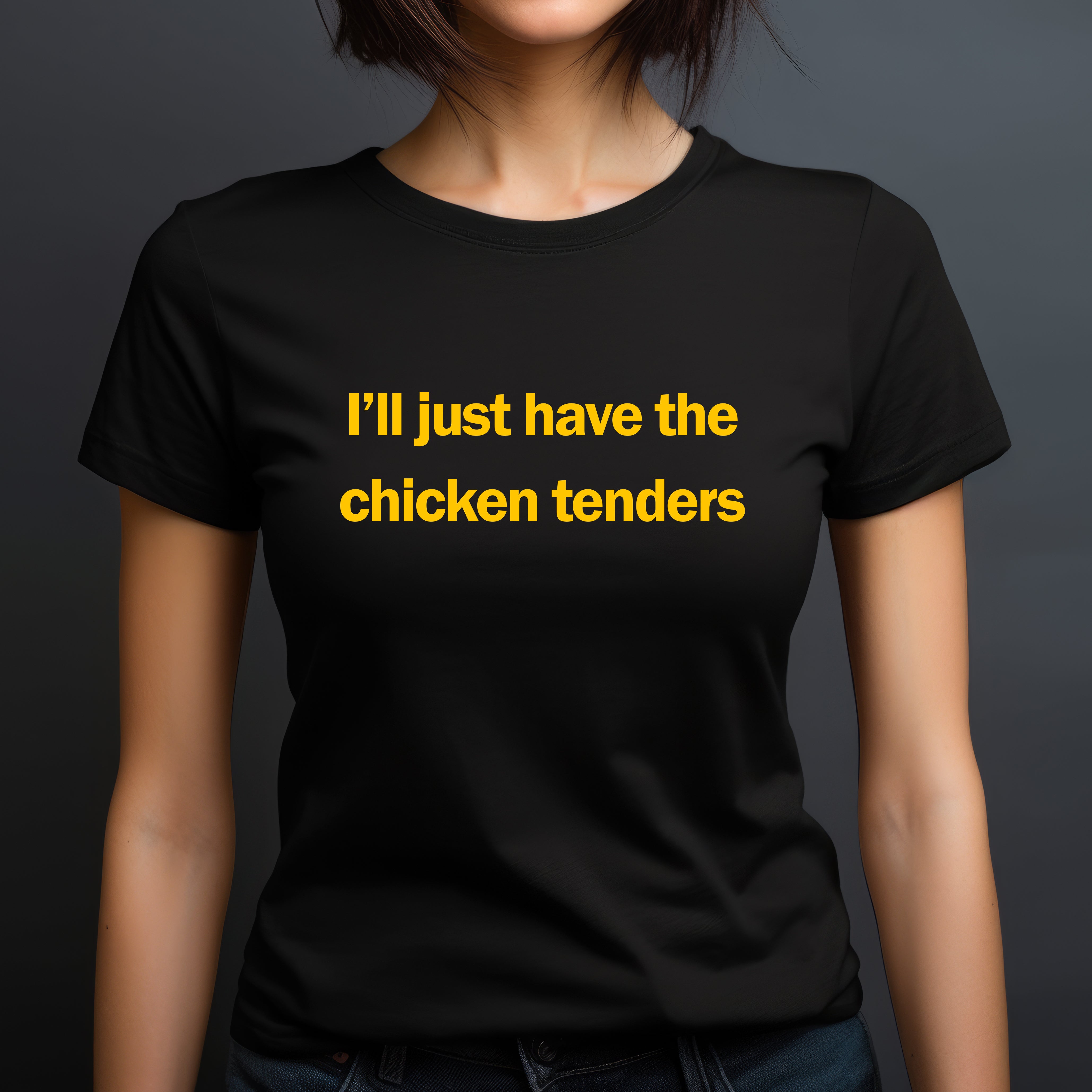 Woman wearing a fitted black t-shirt with yellow text reading I’ll just have the chicken tenders