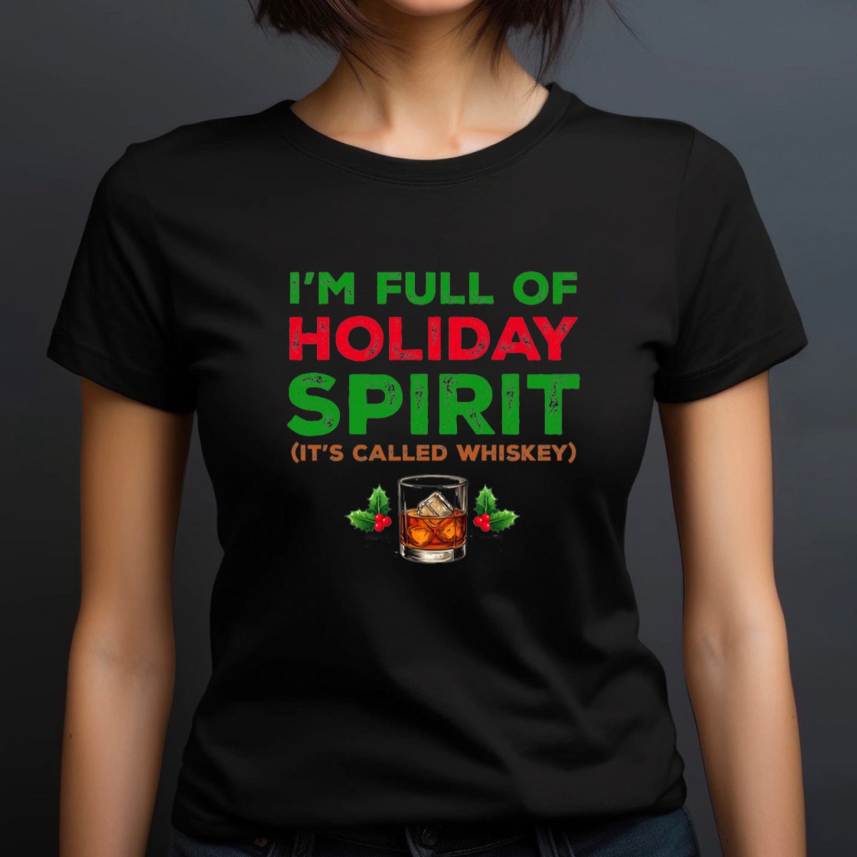 Woman in crew neck holiday whiskey spirit Christmas shirt with festive text and whiskey glass with holly design